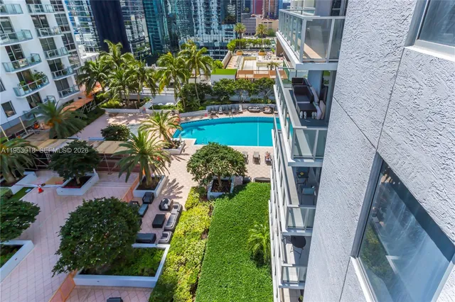 a spacious bedroom with a bed and a table in it