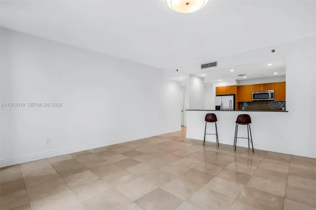 a view of kitchen with furniture and window