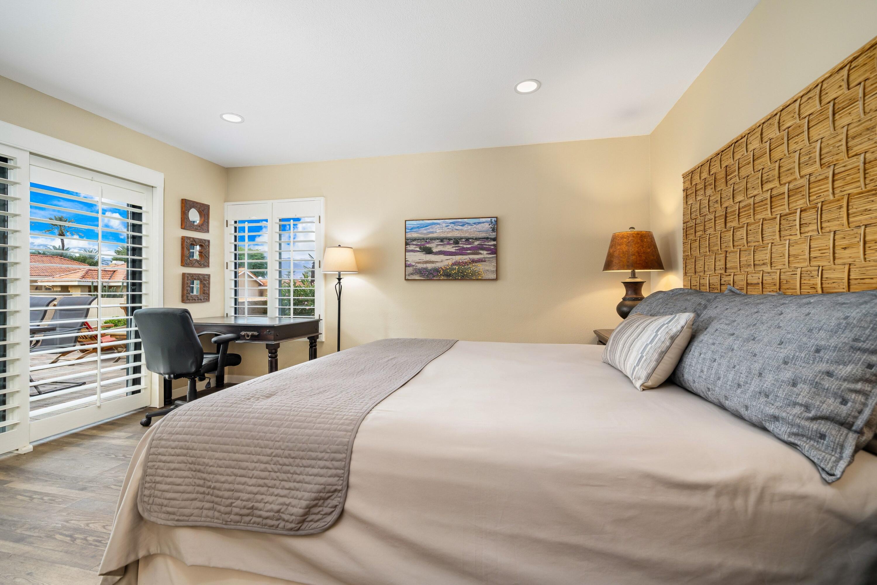 29 Verde Way Palm Desert, CA 92260 - Photo 15 of 43 a bedroom with a large bed and a window