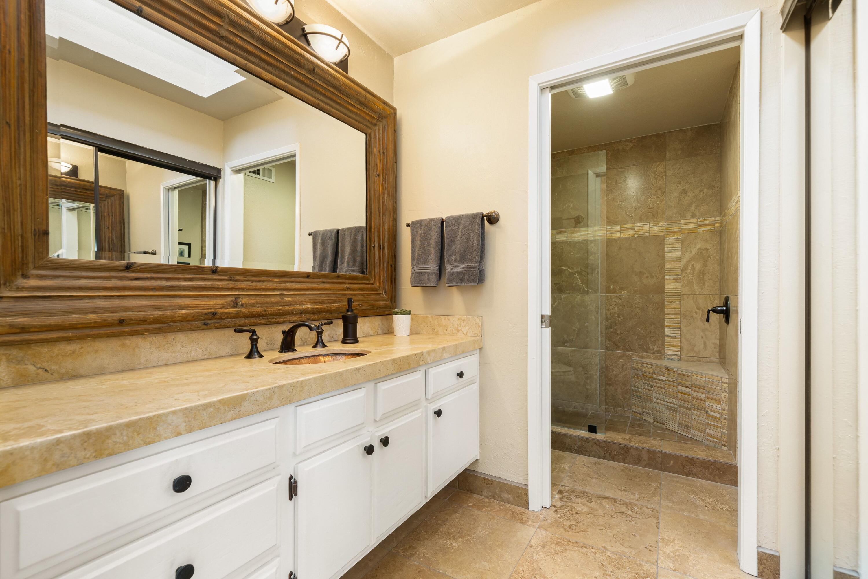 29 Verde Way Palm Desert, CA 92260 - Photo 17 of 43 a bathroom with a granite countertop sink mirror and shower