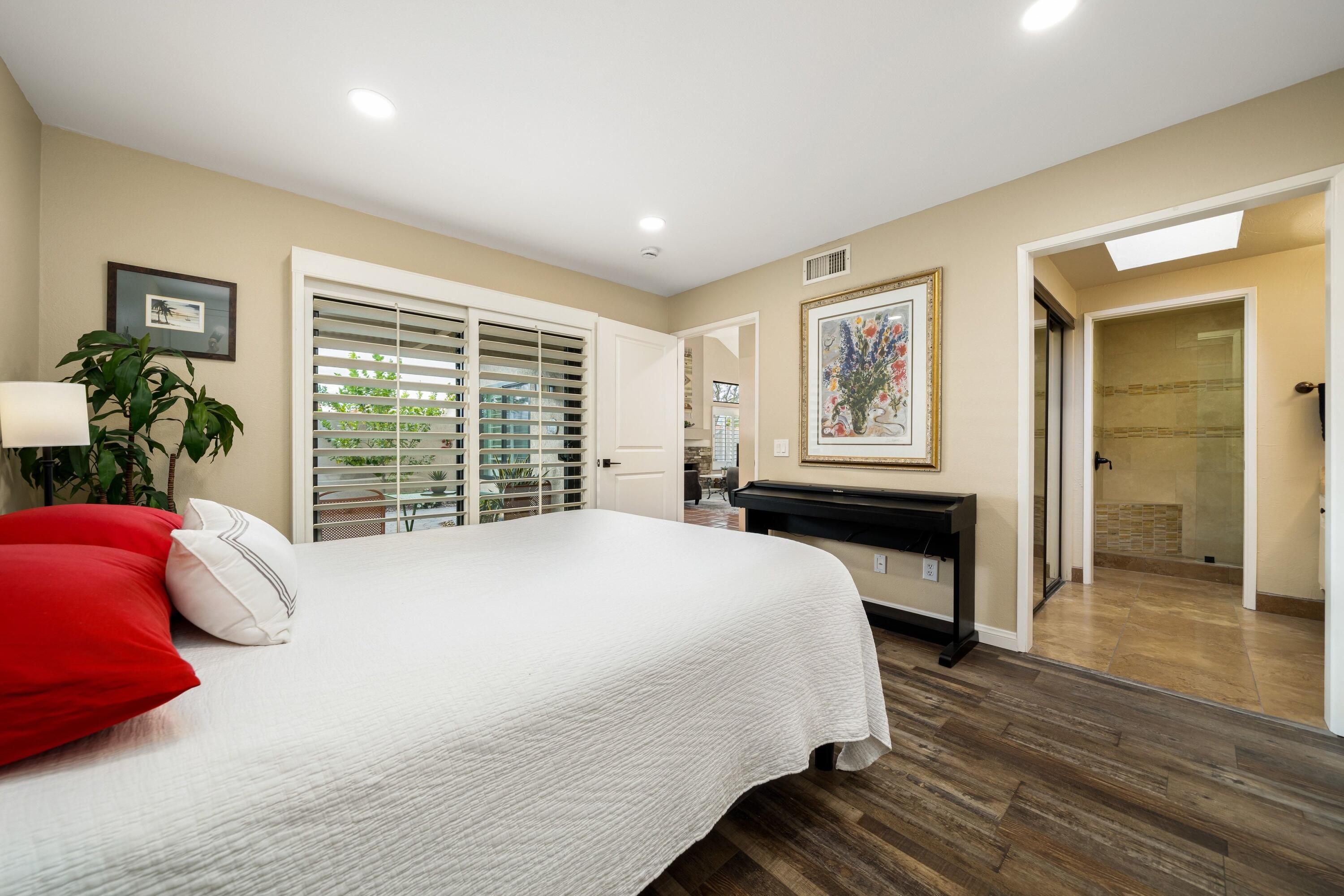 29 Verde Way Palm Desert, CA 92260 - Photo 19 of 43 a bed sitting in a bedroom next to a window