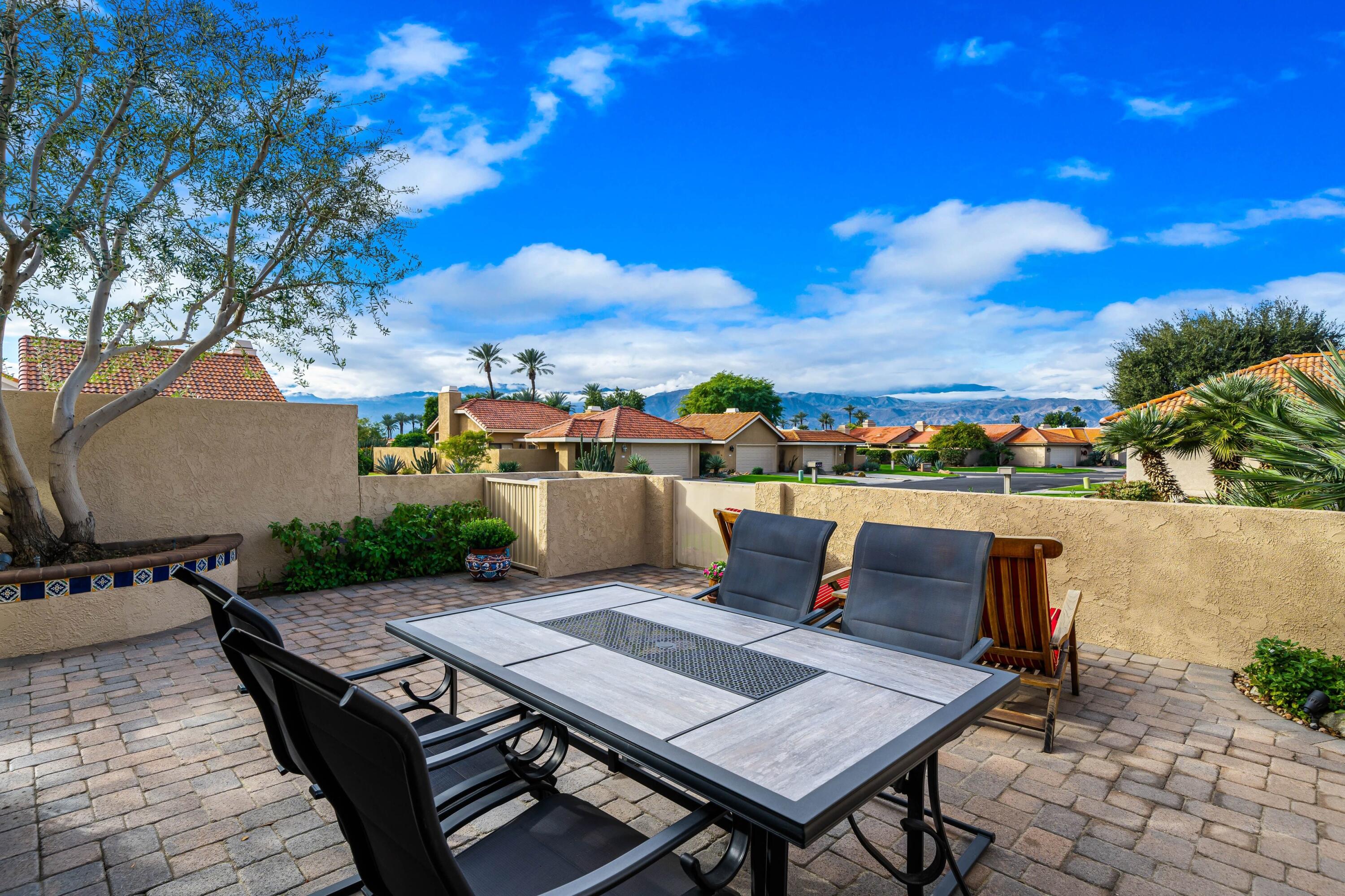29 Verde Way Palm Desert, CA 92260 - Photo 22 of 43 a roof deck with a table and chairs