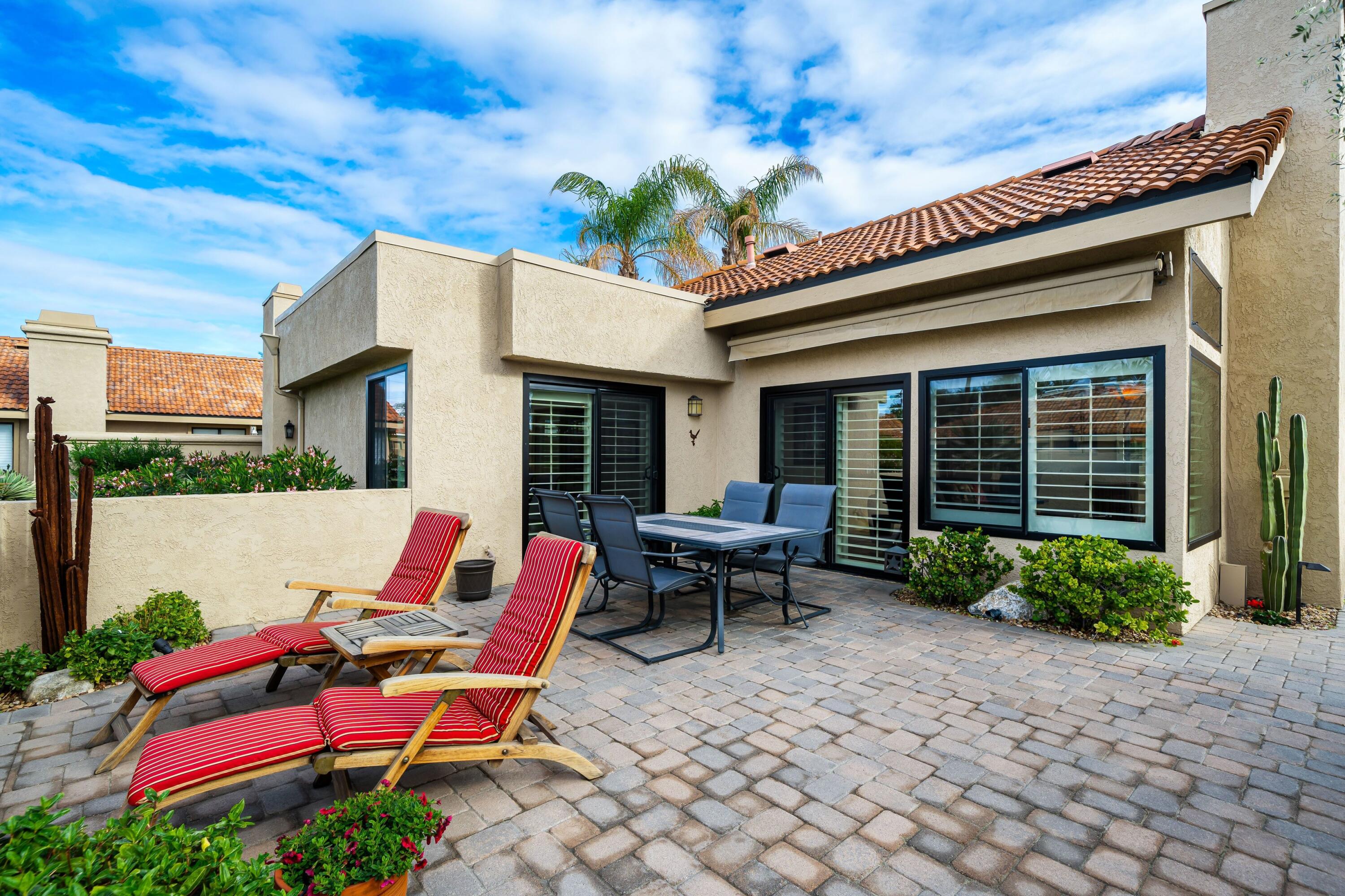 29 Verde Way Palm Desert, CA 92260 - Photo 26 of 43 a backyard of a house with outdoor seating