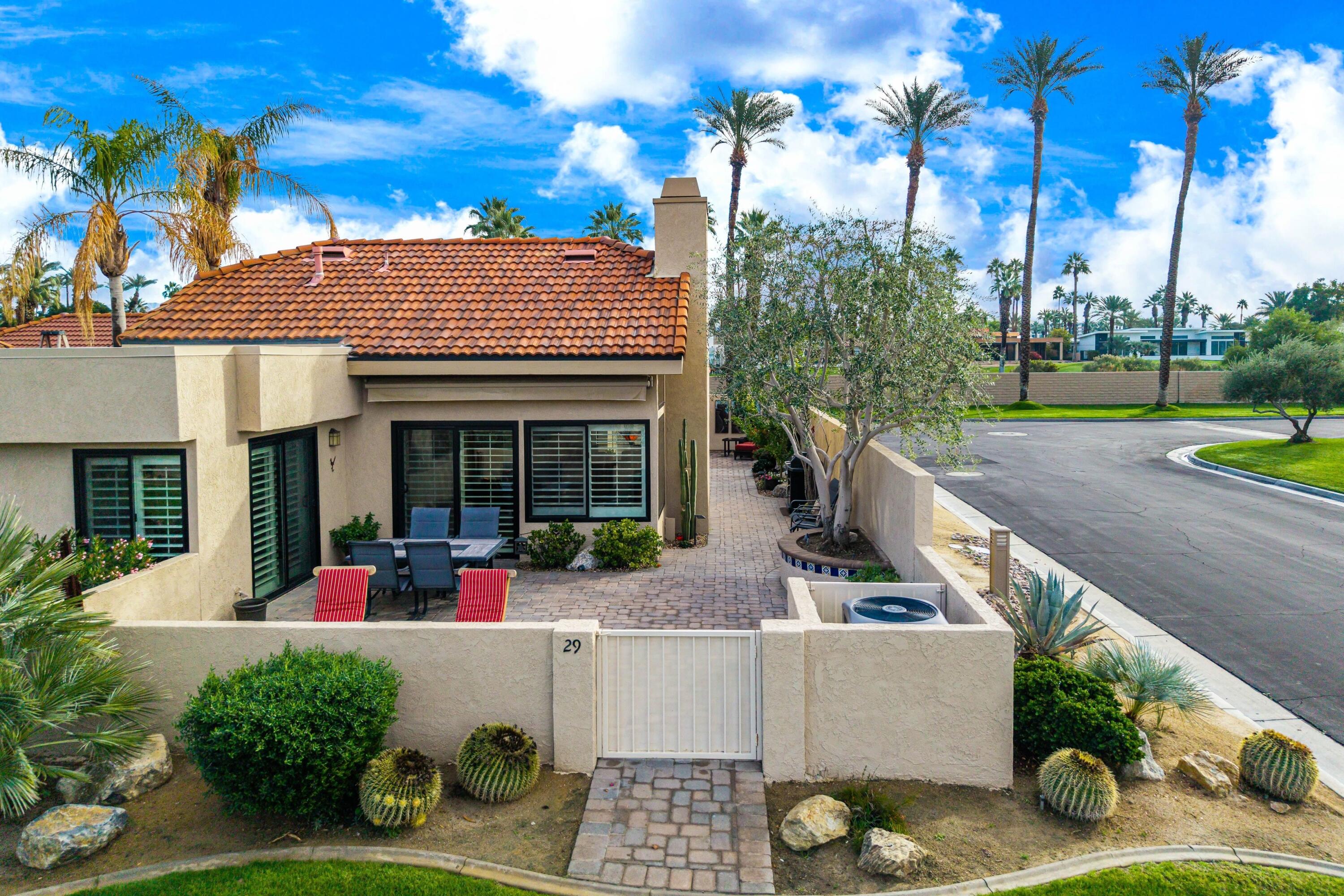29 Verde Way Palm Desert, CA 92260 - Photo 30 of 43 a view of a house with sitting area and garden