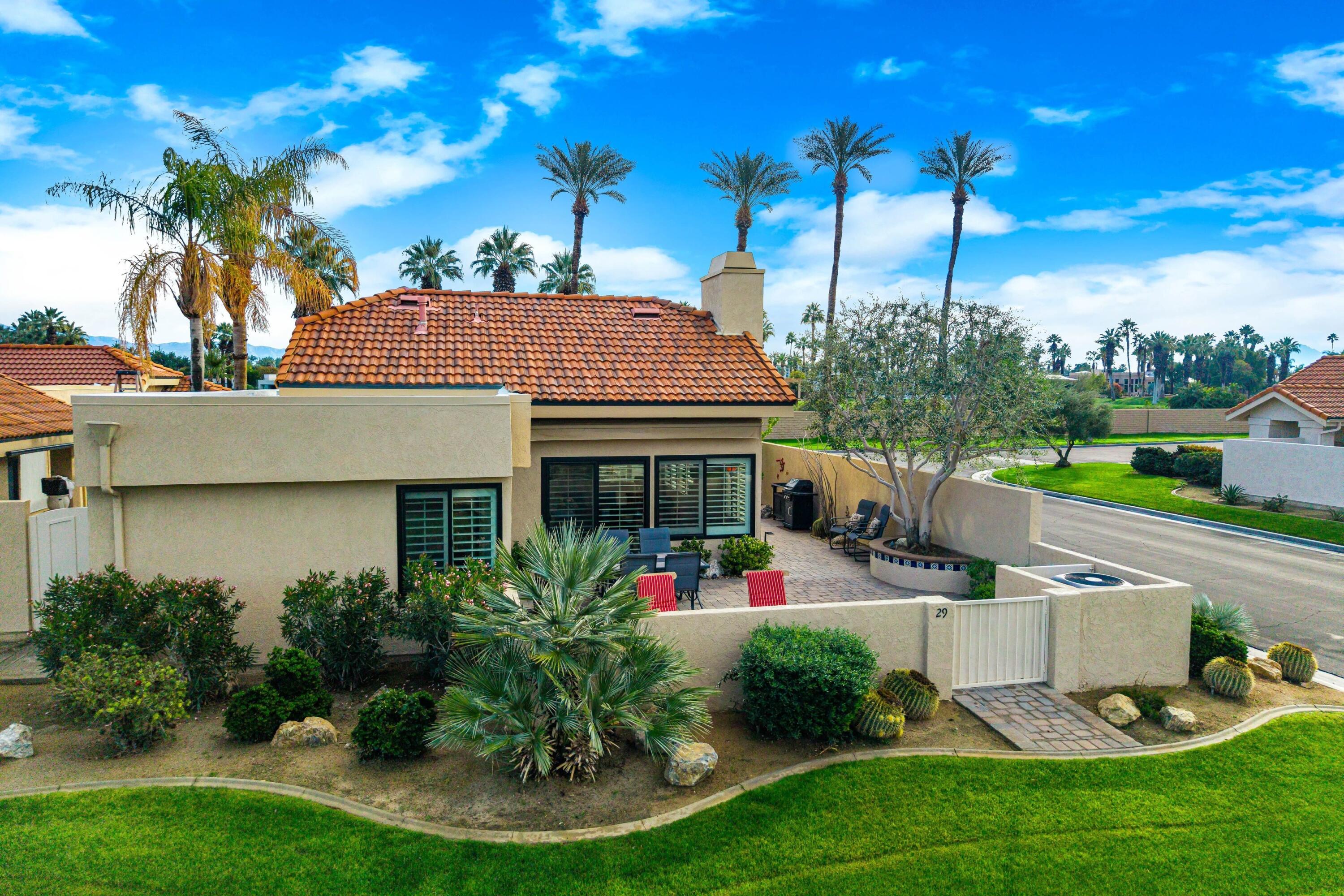 29 Verde Way Palm Desert, CA 92260 - Photo 31 of 43 a front view of a house with garden
