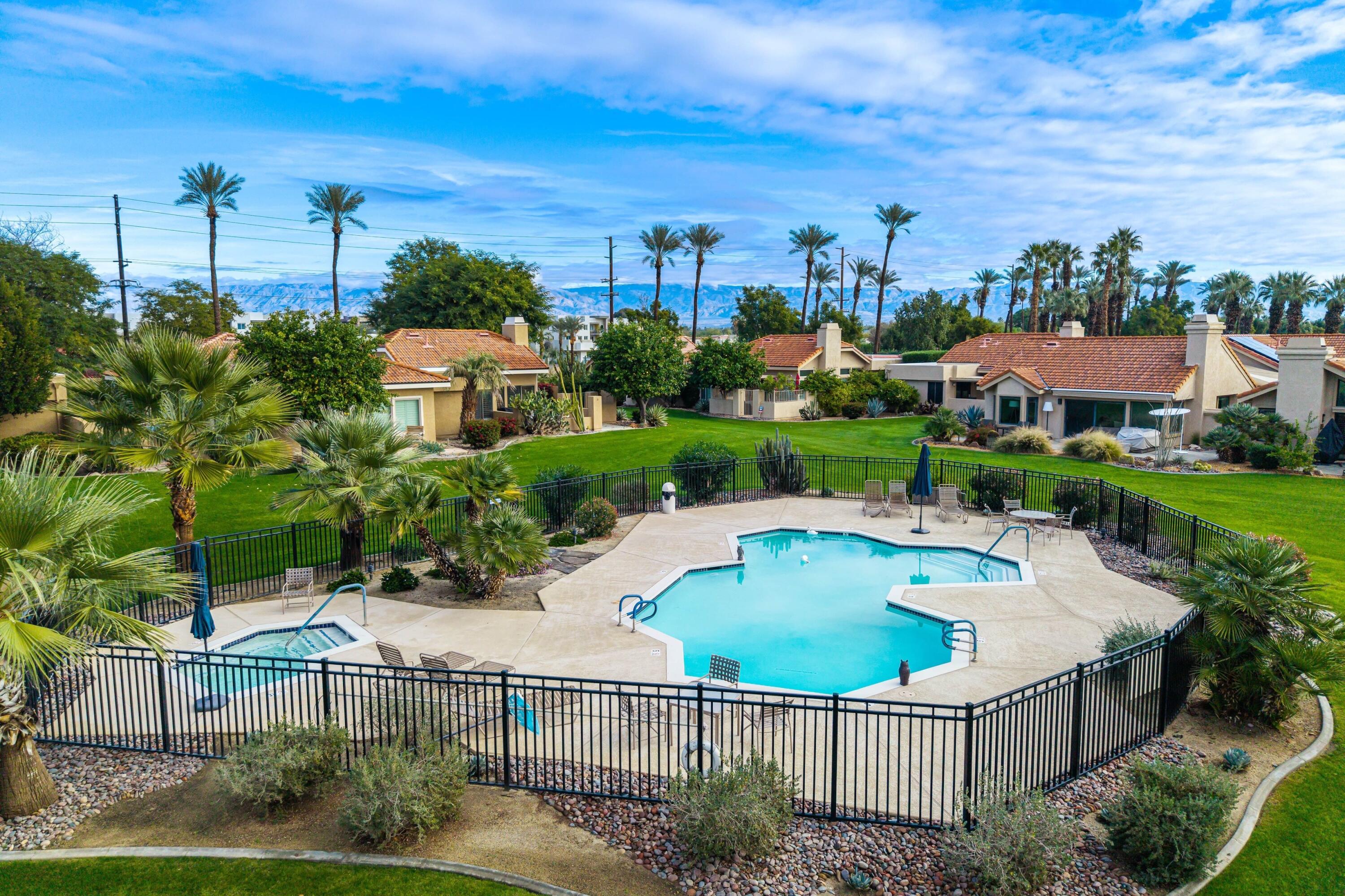 29 Verde Way Palm Desert, CA 92260 - Photo 37 of 43 a view of a house with a yard and potted plants