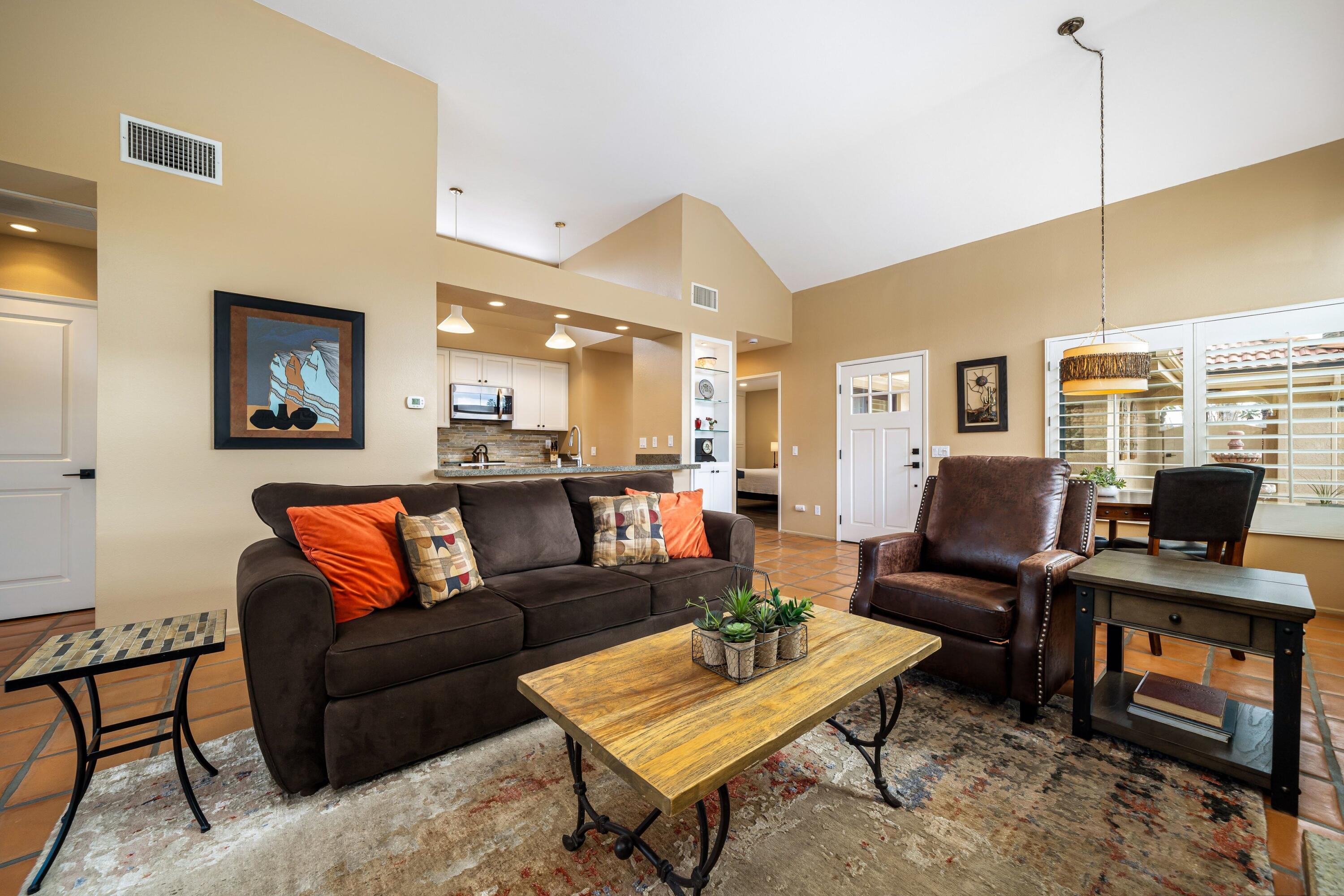 29 Verde Way Palm Desert, CA 92260 - Photo 9 of 43 a view of a livingroom with furniture and a flat screen tv
