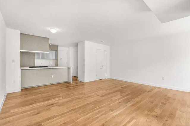 a view of kitchen with wooden floor
