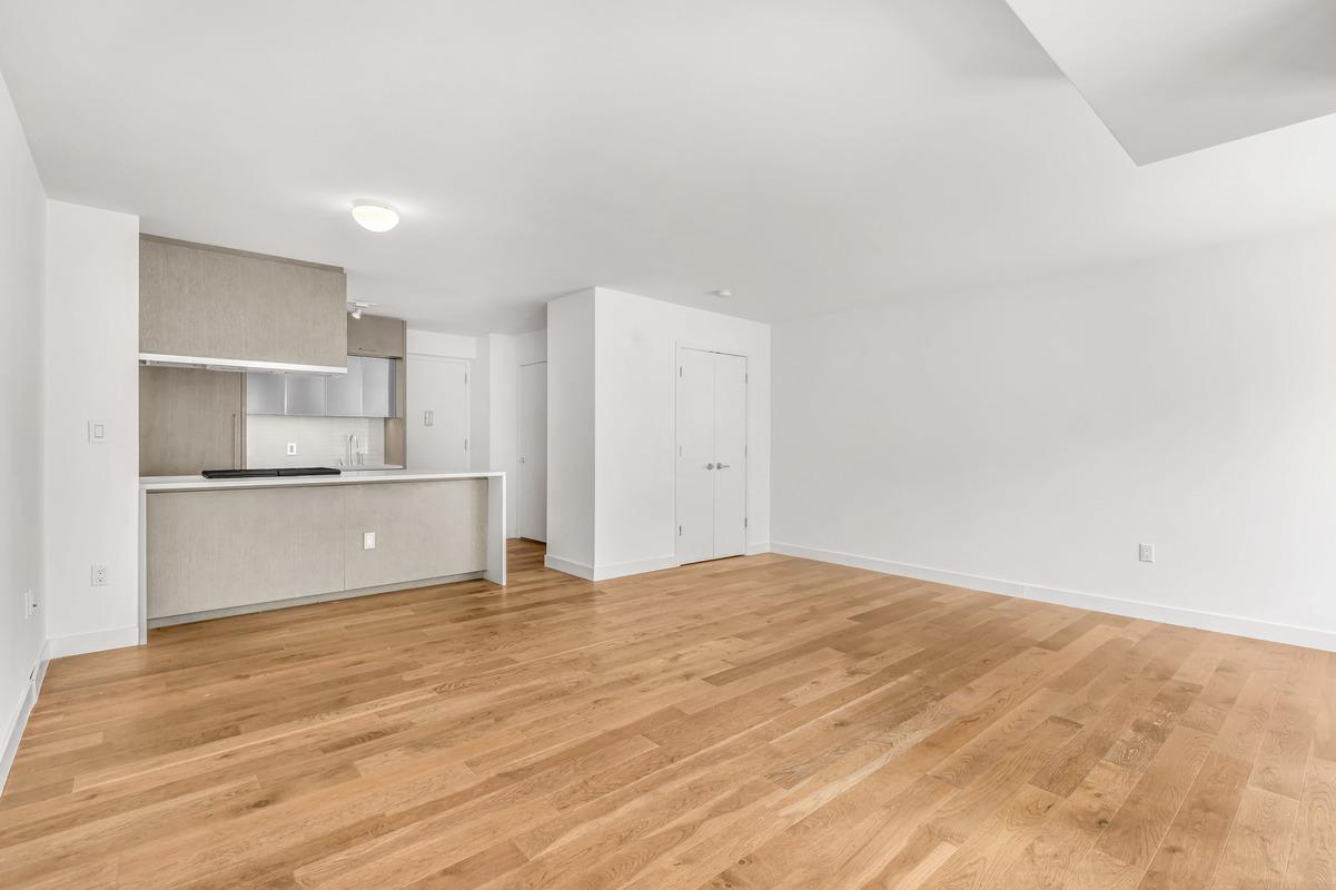 225 Rector Place, Unit 2DD Manhattan, NY 10280 - Photo 1 of 12 a view of kitchen with wooden floor