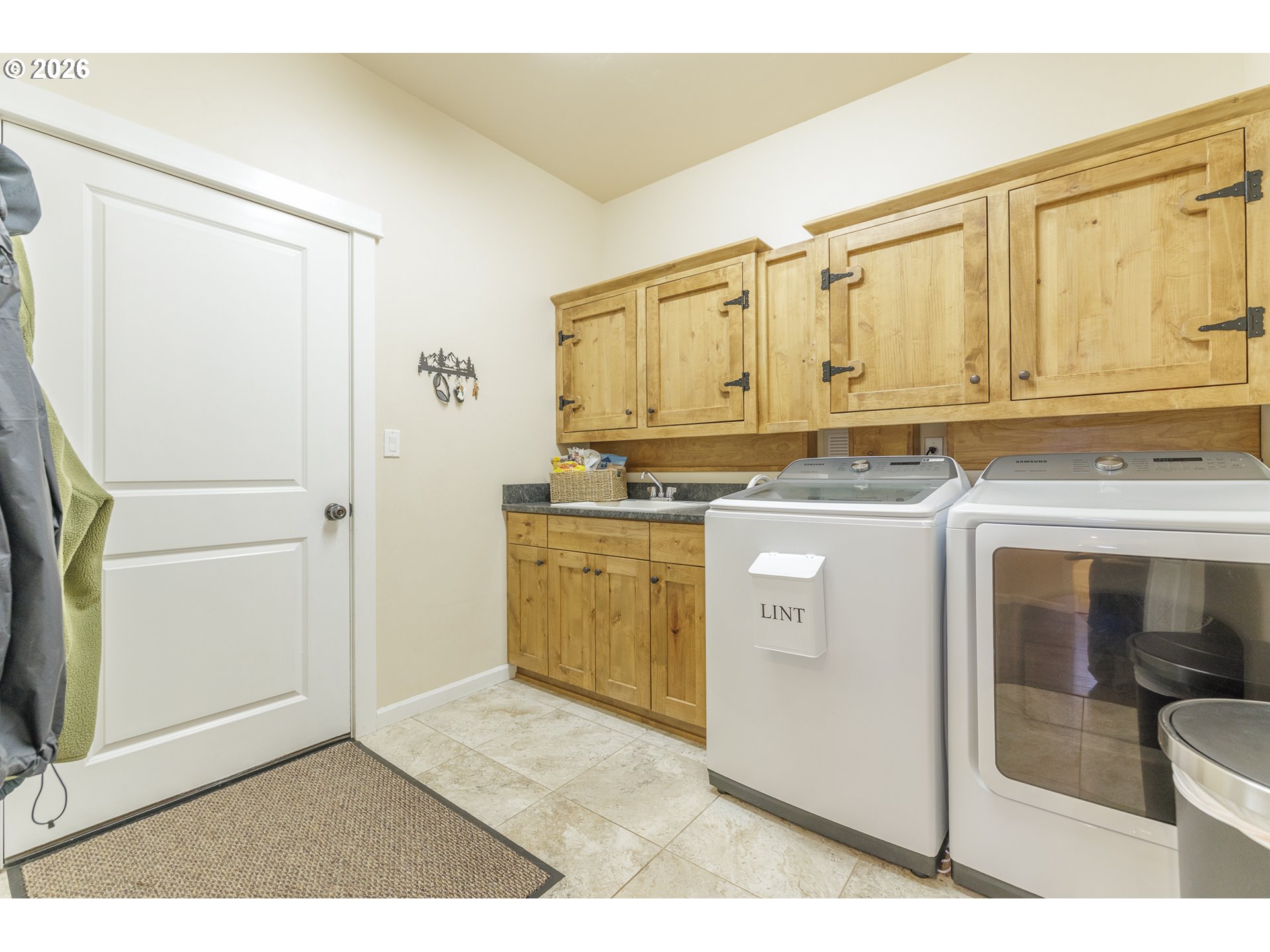 16802 Pony Express Way Bend, OR 97707 - Photo 20 of 37 a kitchen with white cabinets and white appliances