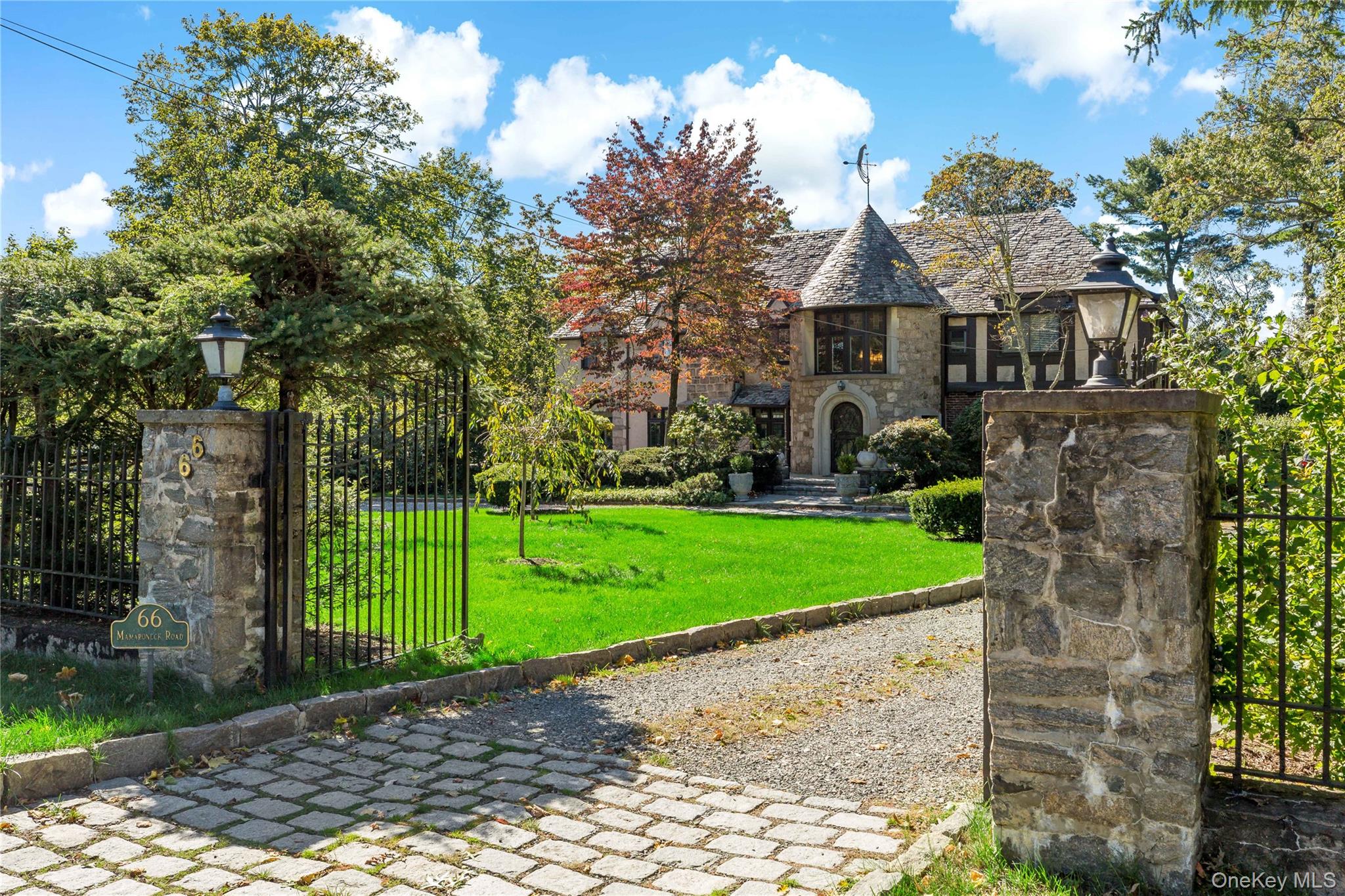 66 Mamaroneck Road Scarsdale, NY 10583 - Photo 1 of 47 A grand entrance framed by stone pillars and wrought-iron gates welcomes you to this distinguished Murray Hill estate, where privacy and presence begin at the curb.
