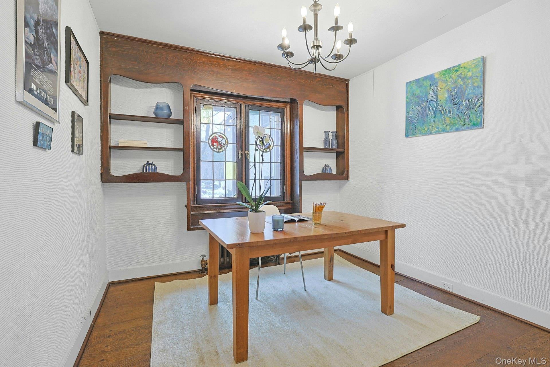 66 Mamaroneck Road Scarsdale, NY 10583 - Photo 11 of 47 A handsome home office featuring original stained-glass windows and custom built-ins, offering a quiet and character-rich space for work or study.