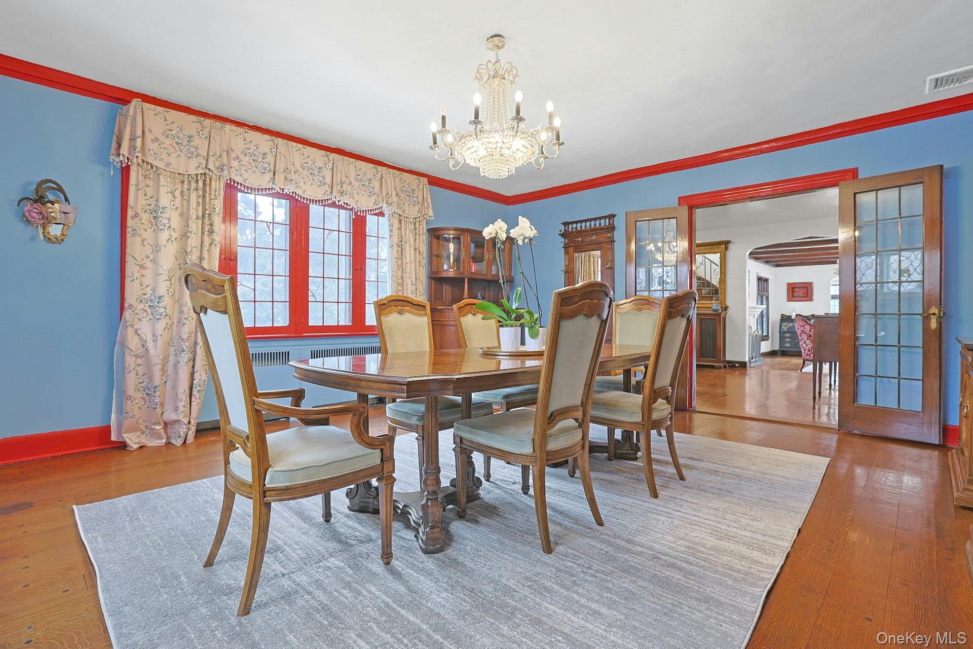 66 Mamaroneck Road Scarsdale, NY 10583 - Photo 12 of 47 Framed by elegant windows and French doors, the dining room offers a refined setting that effortlessly connects to the home’s main living spaces.
