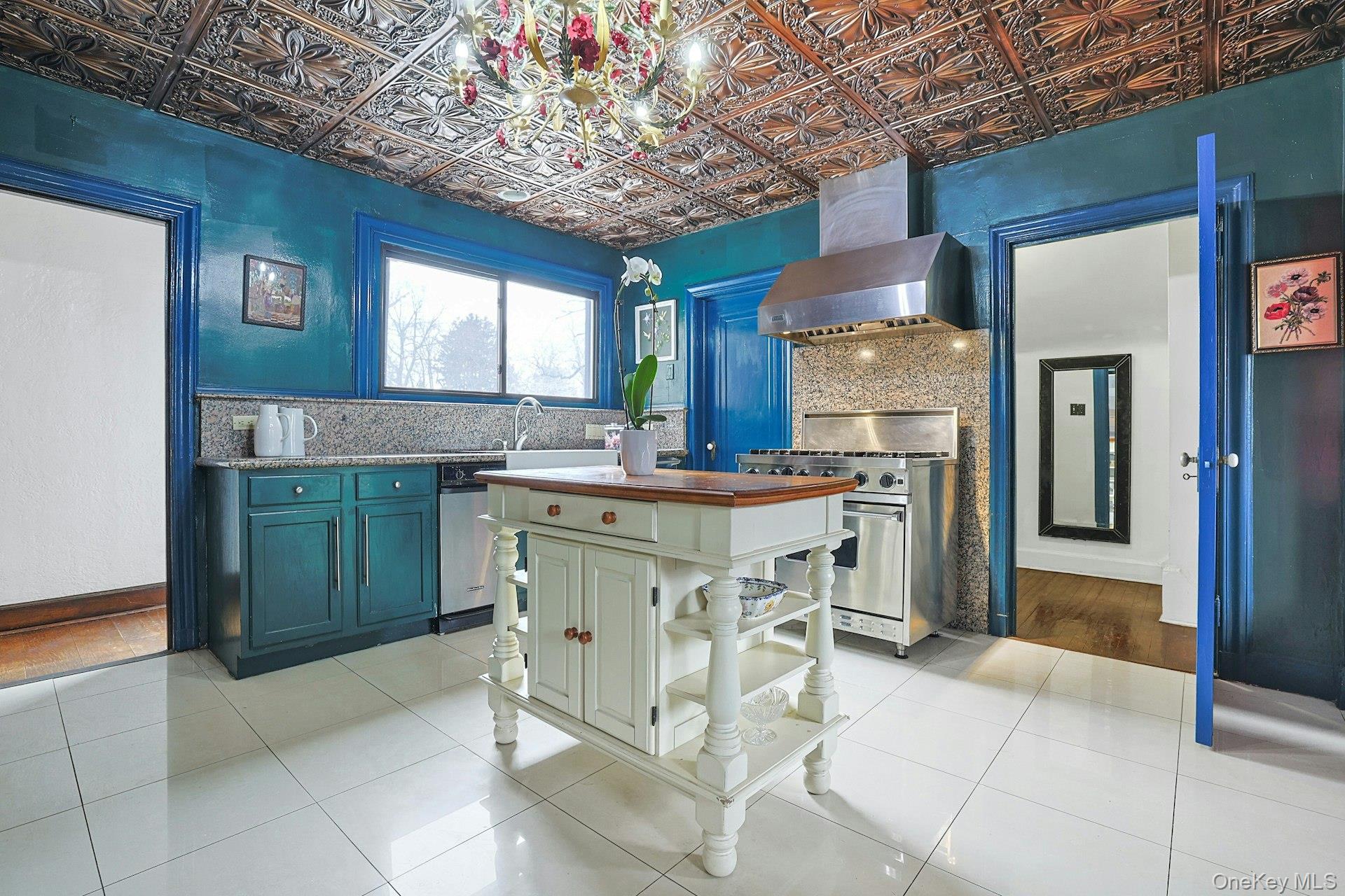 66 Mamaroneck Road Scarsdale, NY 10583 - Photo 15 of 47 A character-rich kitchen blends style with functionality, featuring custom cabinetry, a substantial center island, and thoughtful layout for everyday use.