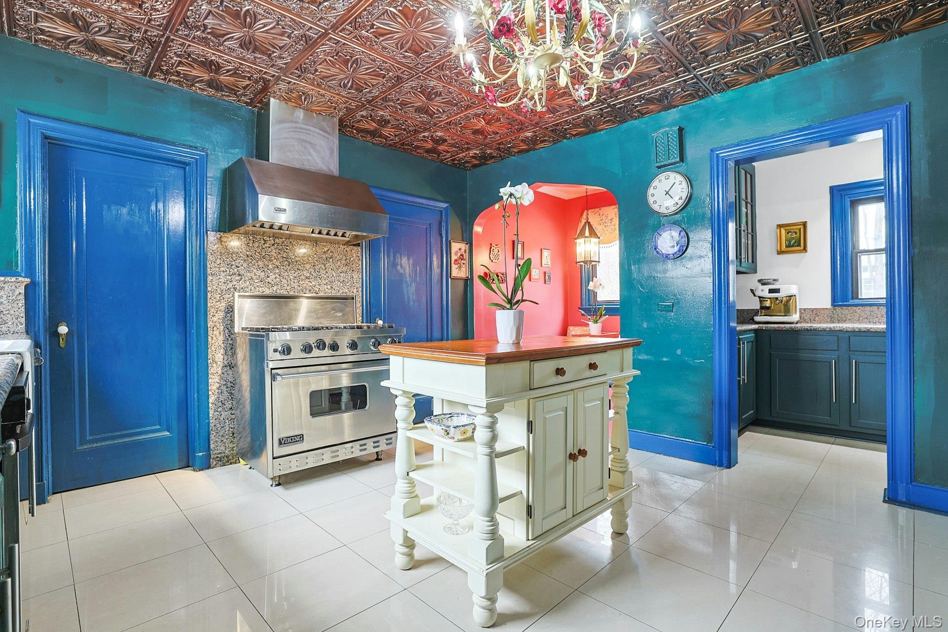 66 Mamaroneck Road Scarsdale, NY 10583 - Photo 18 of 47 Viewed from another angle, the kitchen’s distinctive finishes and architectural details create a warm, inviting hub.