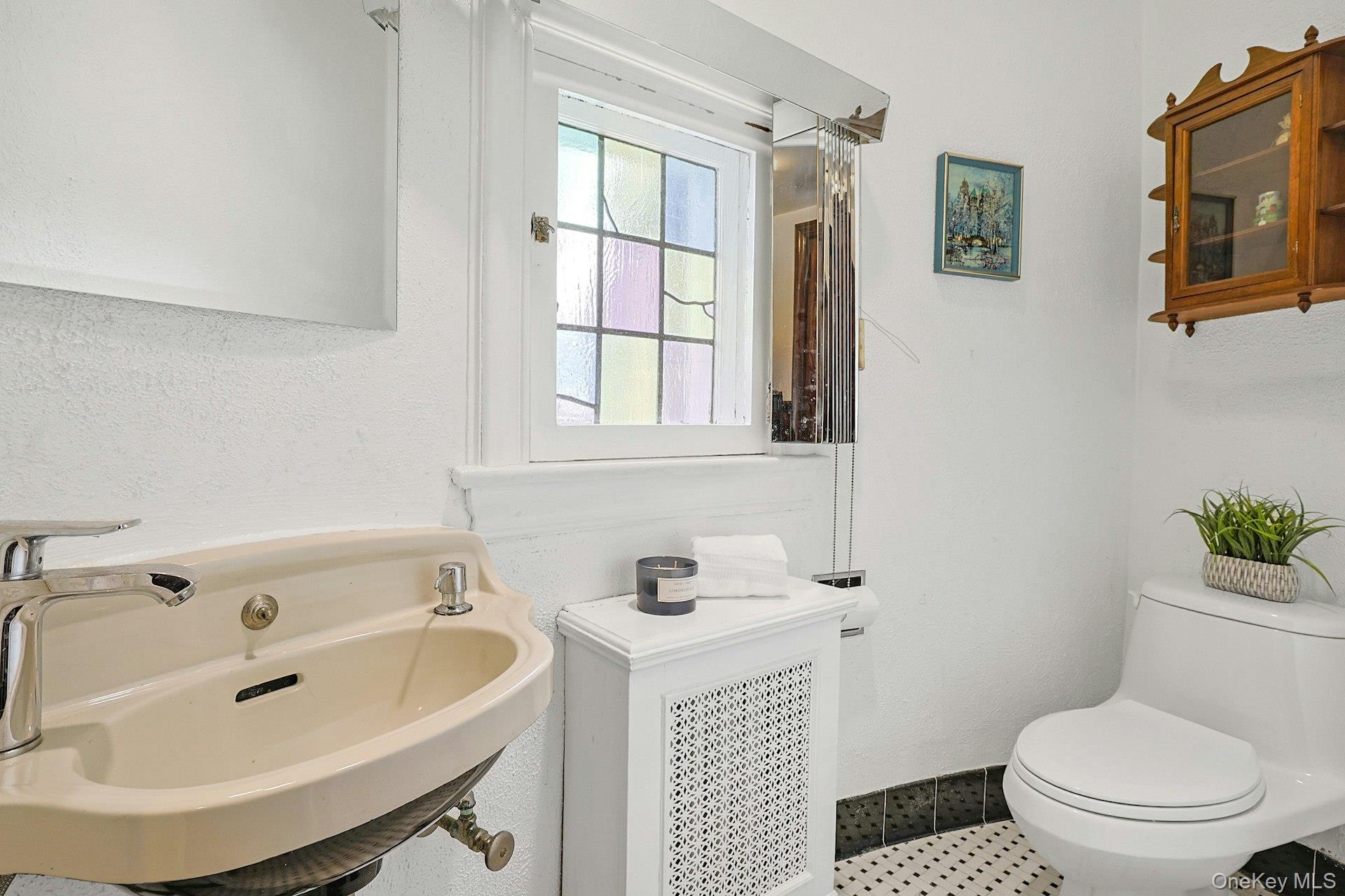 66 Mamaroneck Road Scarsdale, NY 10583 - Photo 19 of 47 A well-appointed first-level powder room offers convenience and charm, thoughtfully positioned just off the main foyer.
