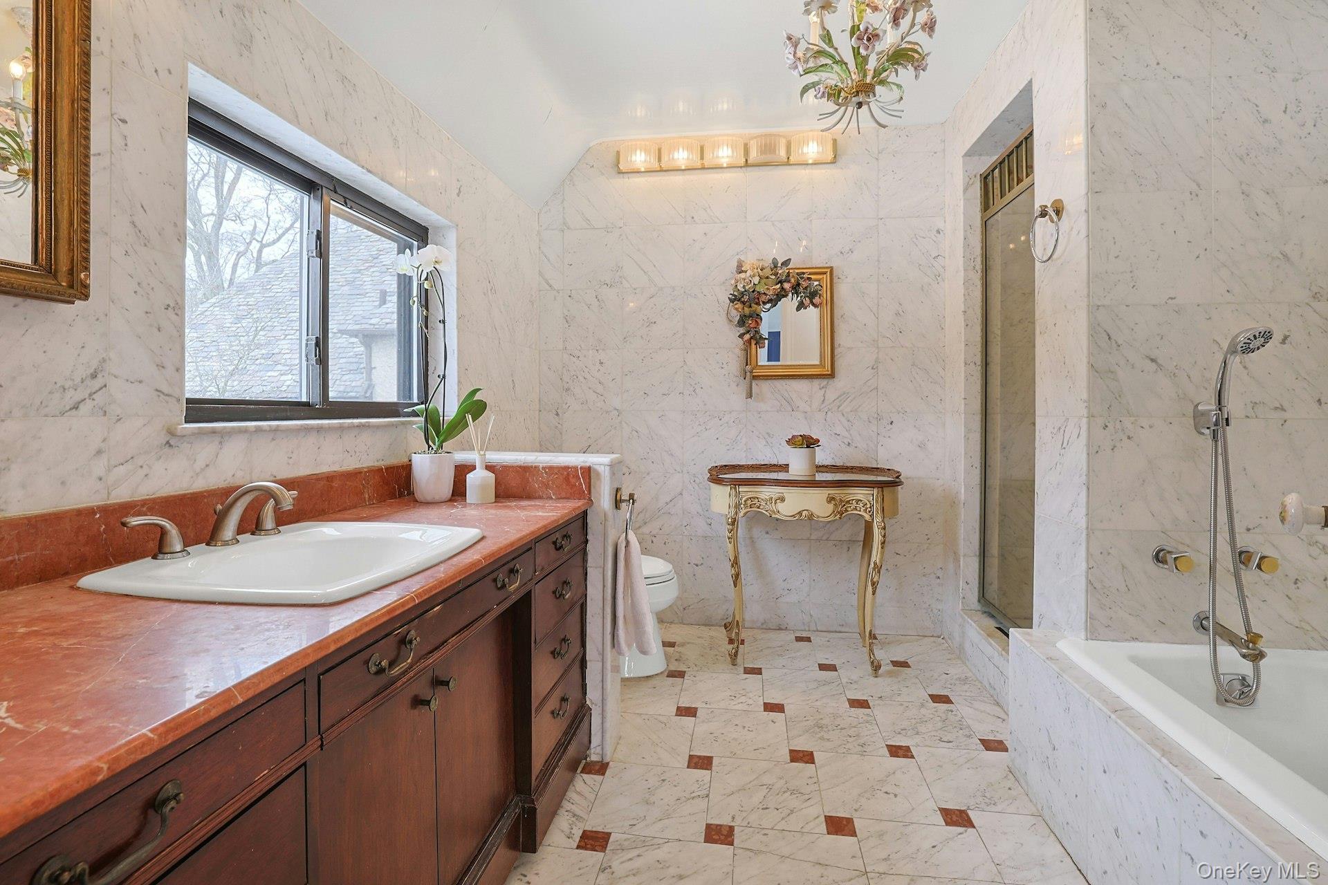 66 Mamaroneck Road Scarsdale, NY 10583 - Photo 23 of 47 A spacious primary bath featuring a large vanity, separate soaking tub, and walk-in shower—designed for both comfort and everyday functionality.