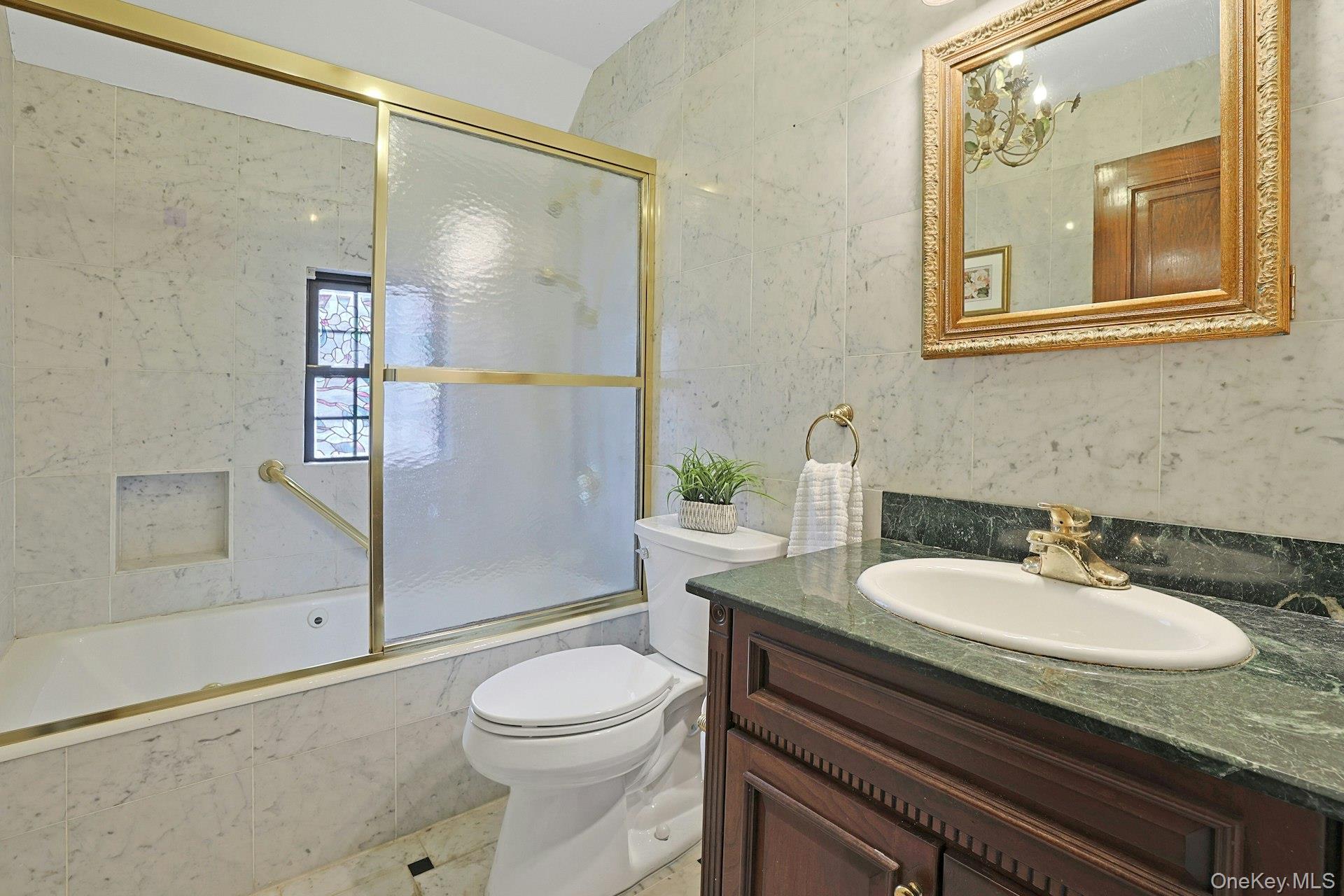 66 Mamaroneck Road Scarsdale, NY 10583 - Photo 26 of 47 A well-maintained hall bathroom featuring a classic vanity and tub/shower combination.