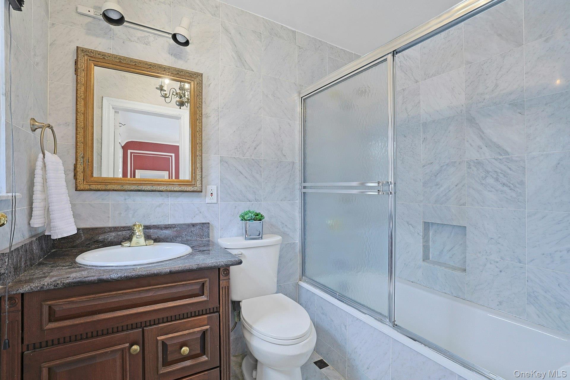 66 Mamaroneck Road Scarsdale, NY 10583 - Photo 28 of 47 A private ensuite full bath with classic finishes and a tub/shower combination, offering comfort and convenience.