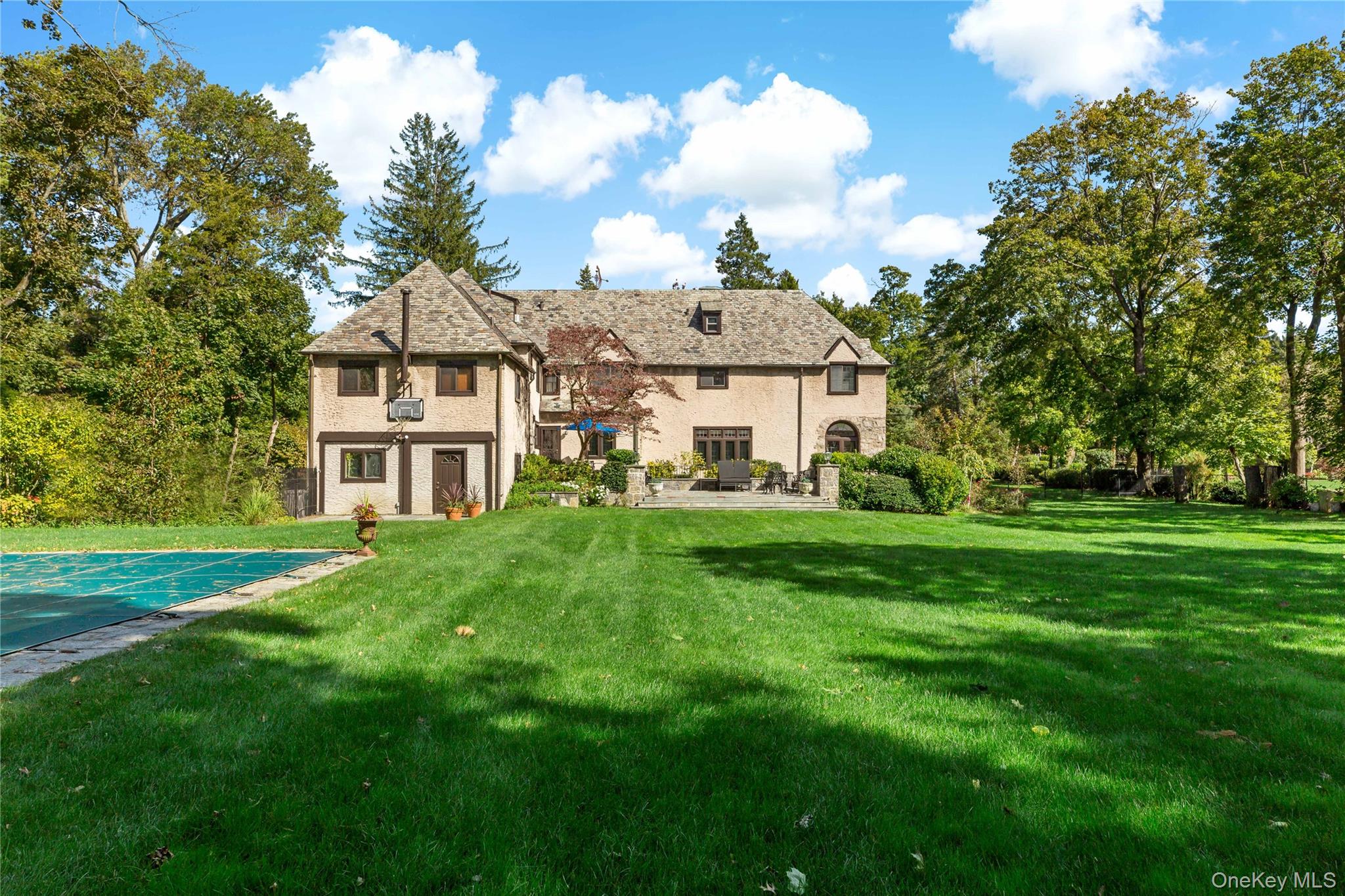 66 Mamaroneck Road Scarsdale, NY 10583 - Photo 31 of 47 An expansive, level backyard creates a stunning backdrop to the home—offering exceptional space for recreation, entertaining, and relaxed outdoor living.