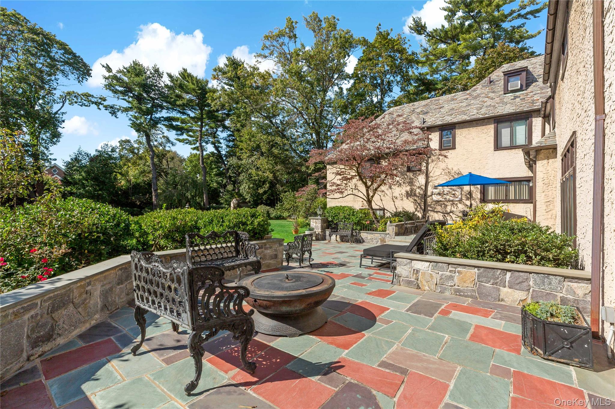66 Mamaroneck Road Scarsdale, NY 10583 - Photo 34 of 47 Perfectly positioned off the home, this inviting patio creates a natural extension of the living space—ideal for gatherings, firepit evenings, or relaxed afternoons.