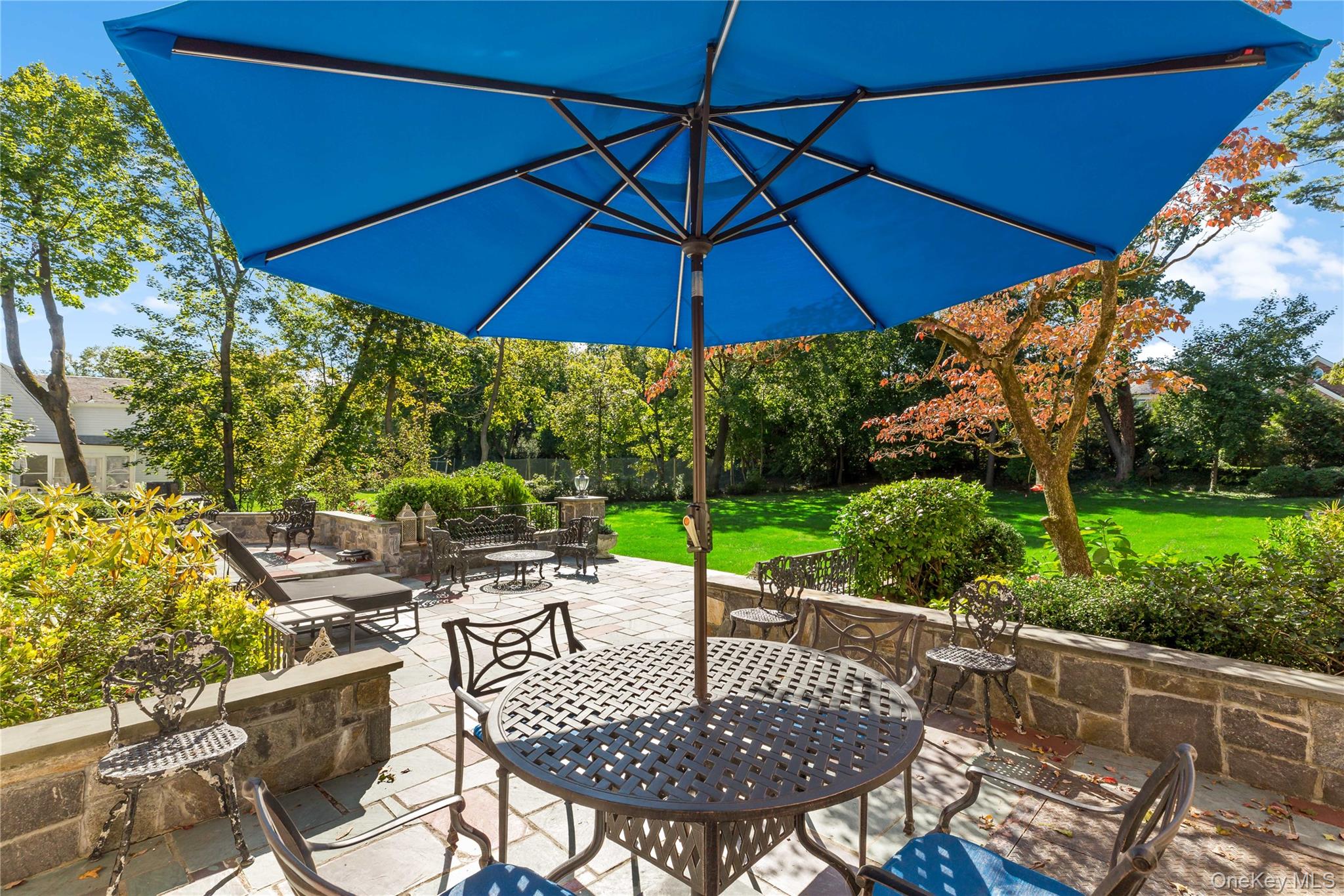 66 Mamaroneck Road Scarsdale, NY 10583 - Photo 35 of 47 A charming outdoor seating area provides a lovely spot for morning coffee or al fresco meals, overlooking the beautifully landscaped backyard.