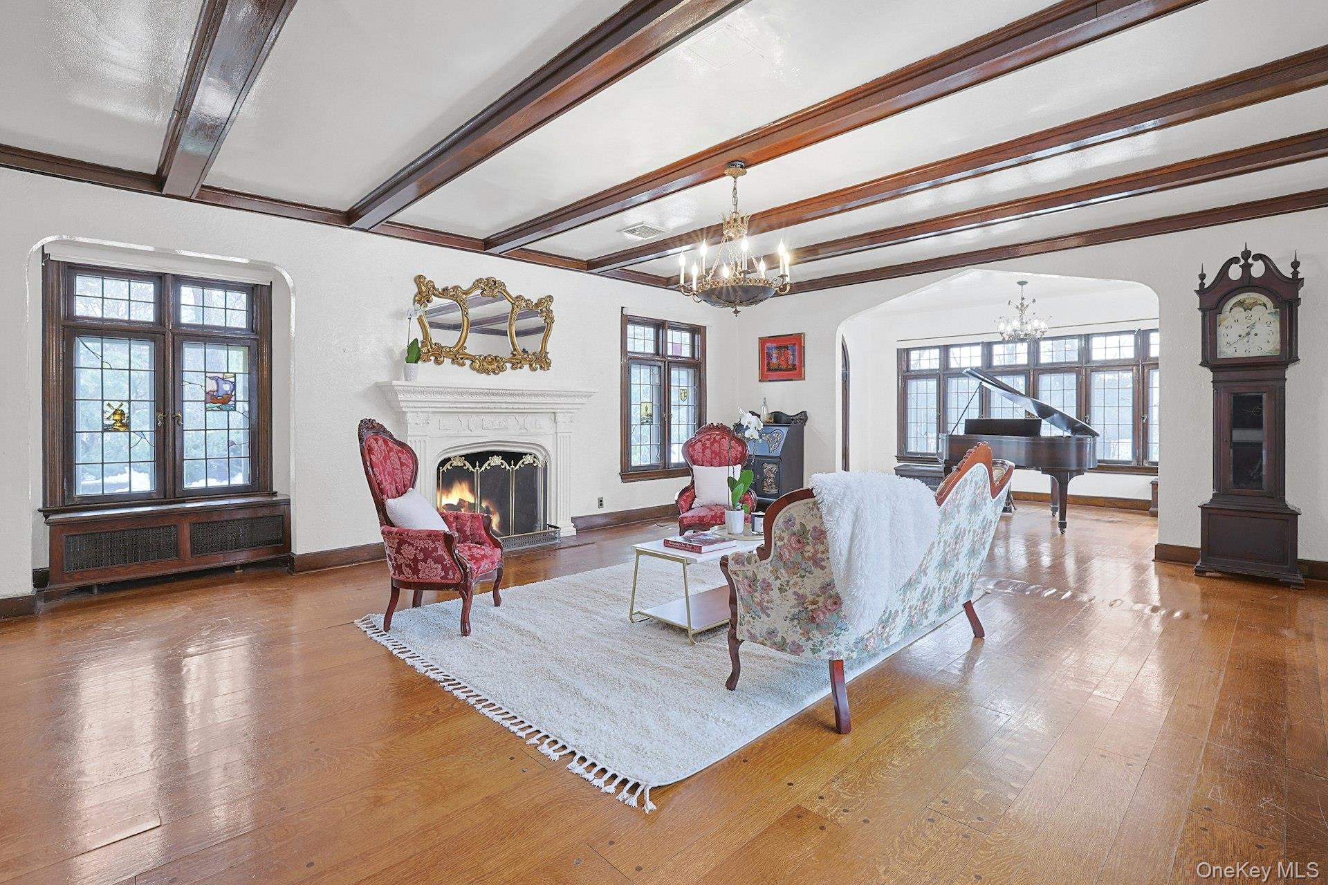 66 Mamaroneck Road Scarsdale, NY 10583 - Photo 6 of 47 An expansive yet inviting living room anchored by warm hardwood floors and beautifully scaled spaces ideal for both everyday living and elegant entertaining.