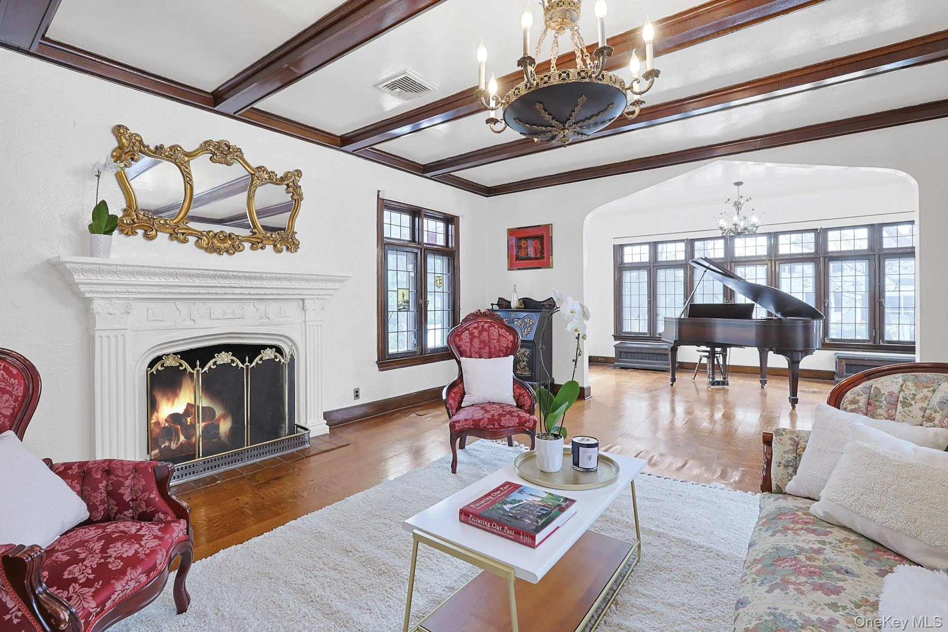 66 Mamaroneck Road Scarsdale, NY 10583 - Photo 7 of 47 Rich architectural details—beamed ceilings, leaded windows, and a wood-burning fireplace with original mantel—create a timeless and welcoming atmosphere.