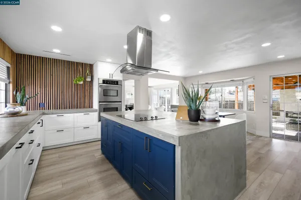 a bathroom with a double vanity sink toilet and shower