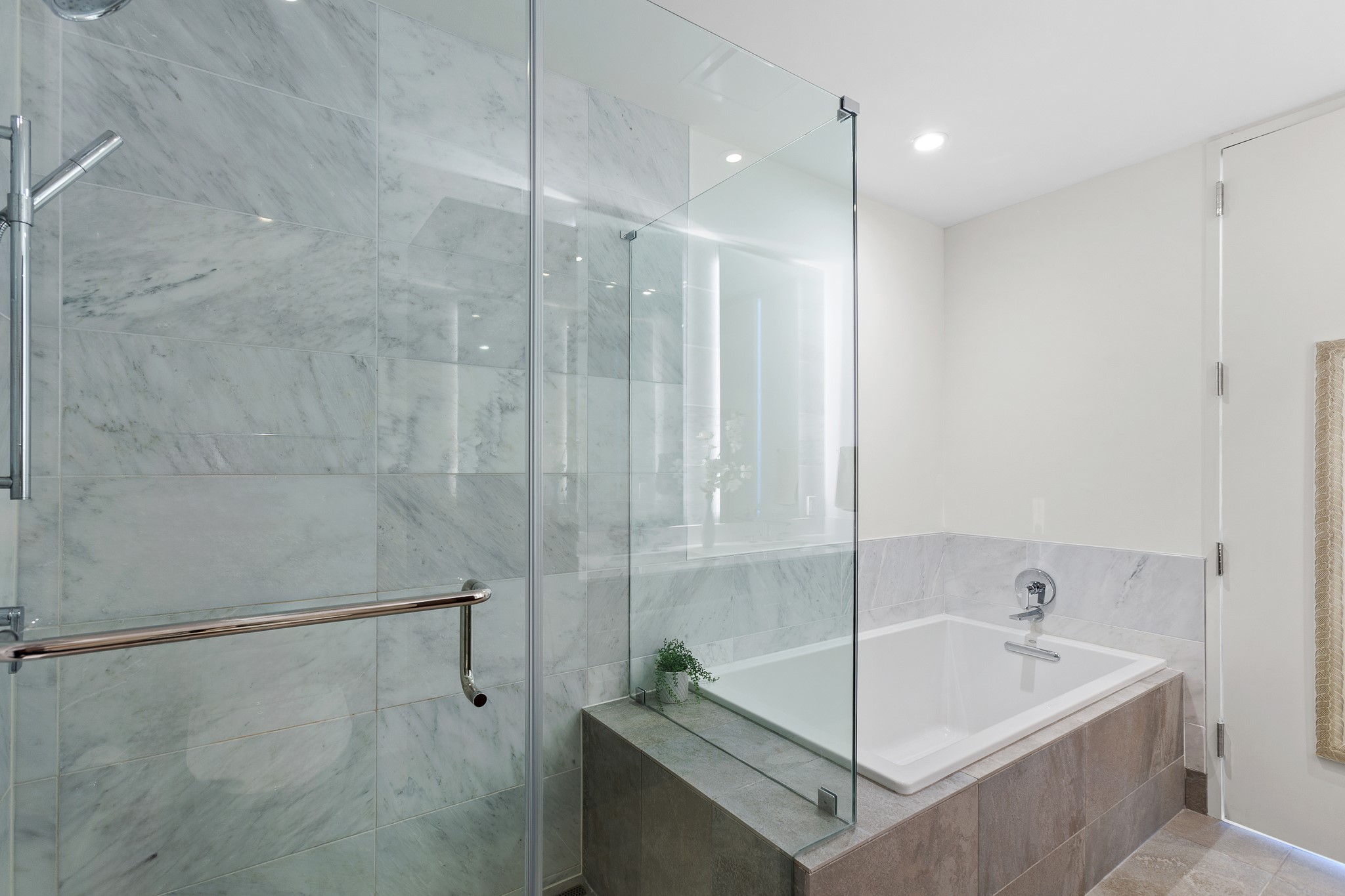 301 West Avenue, Unit 5002 Austin, TX 78701 - Photo 12 of 39 a bathroom with a tub and shower