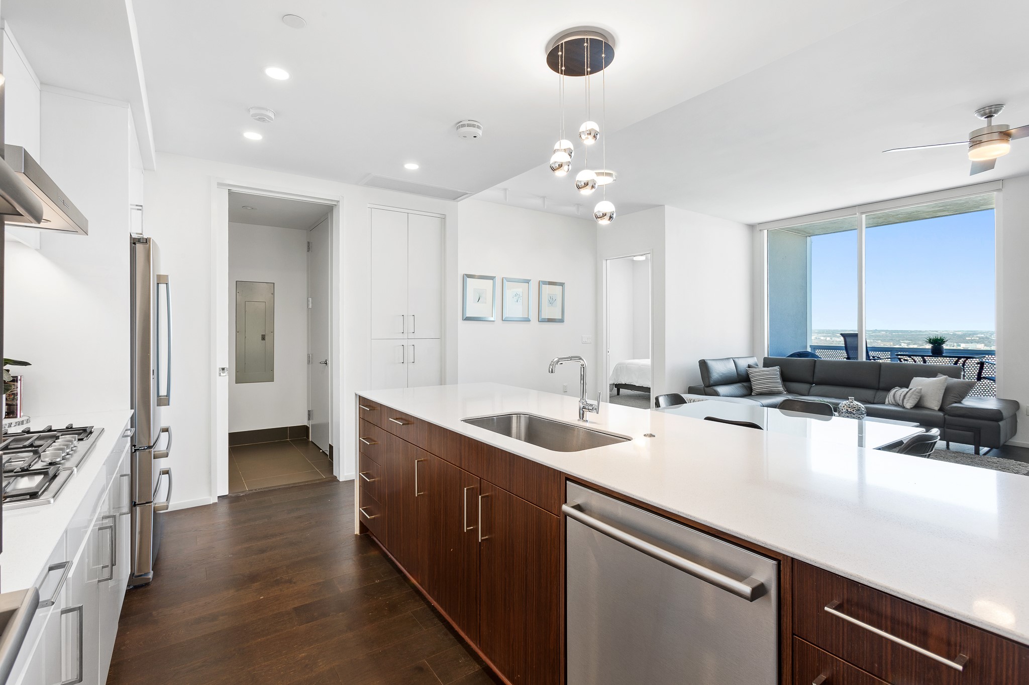 301 West Avenue, Unit 5002 Austin, TX 78701 - Photo 2 of 39 a kitchen with a sink a counter top space and stainless steel appliances