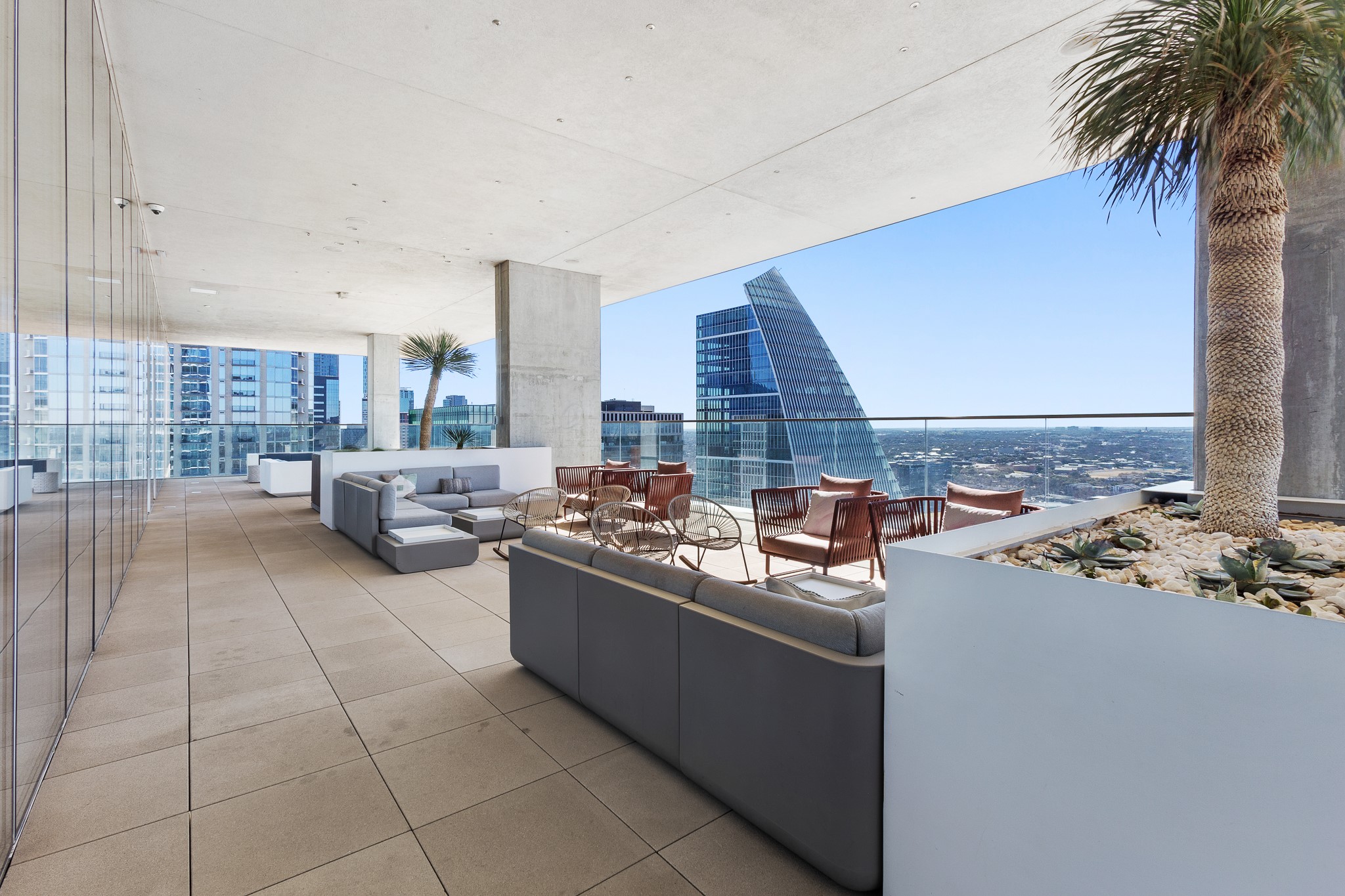 301 West Avenue, Unit 5002 Austin, TX 78701 - Photo 26 of 39 a view of a kitchen with kitchen island granite countertop a sink and a stove top oven