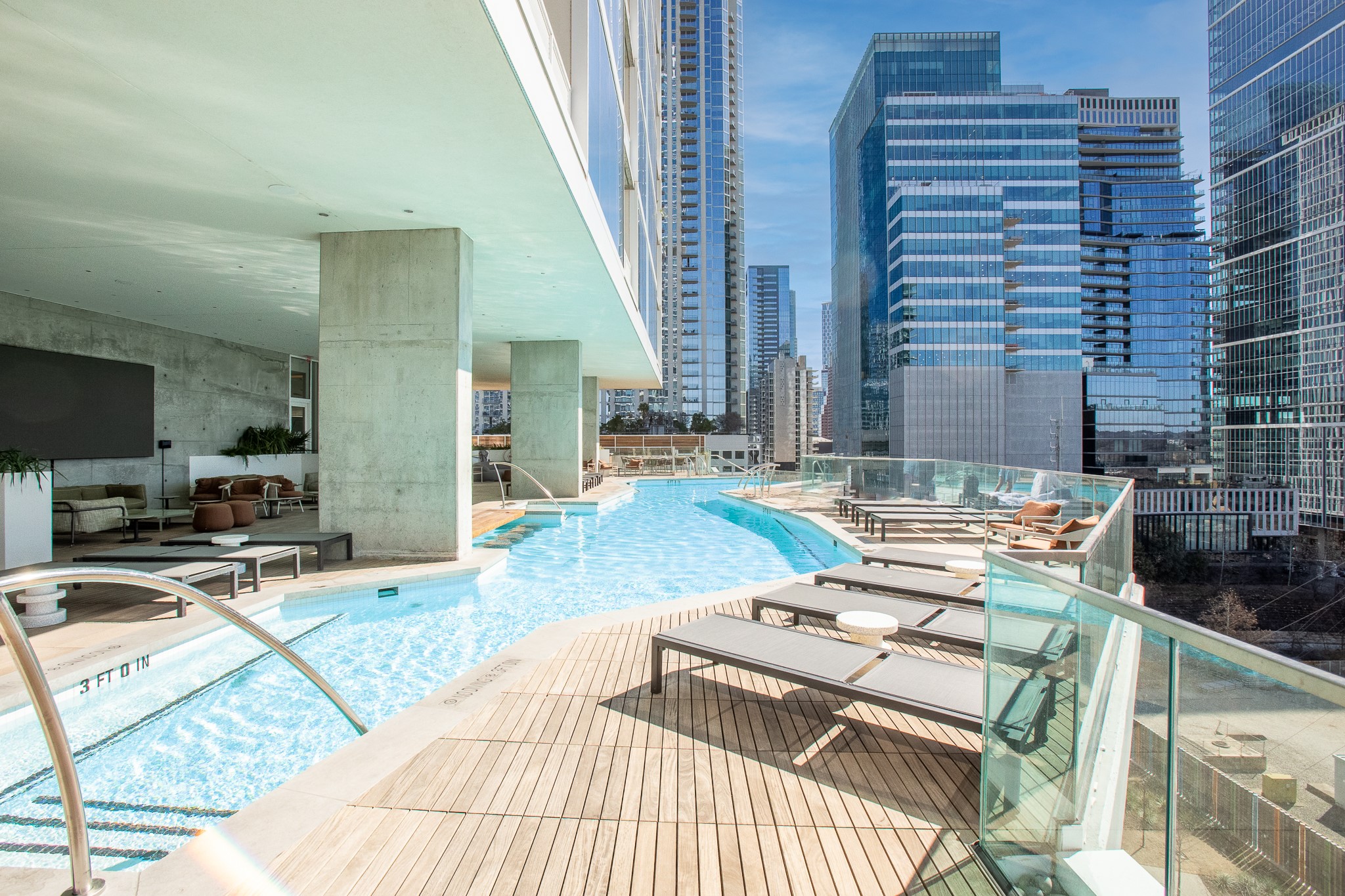 301 West Avenue, Unit 5002 Austin, TX 78701 - Photo 34 of 39 a living room with furniture and a flat screen tv