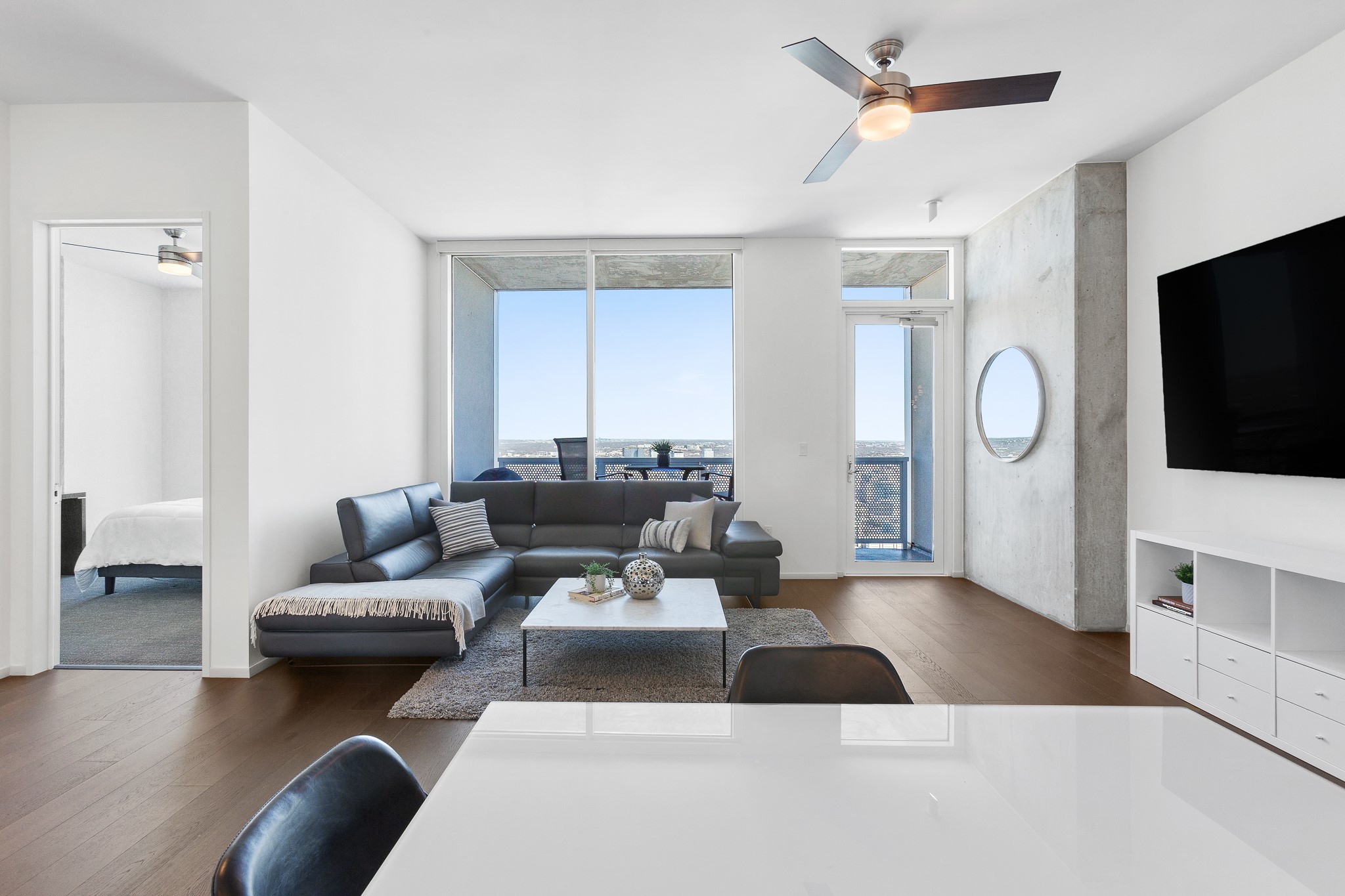 301 West Avenue, Unit 5002 Austin, TX 78701 - Photo 7 of 39 a living room with furniture and a flat screen tv