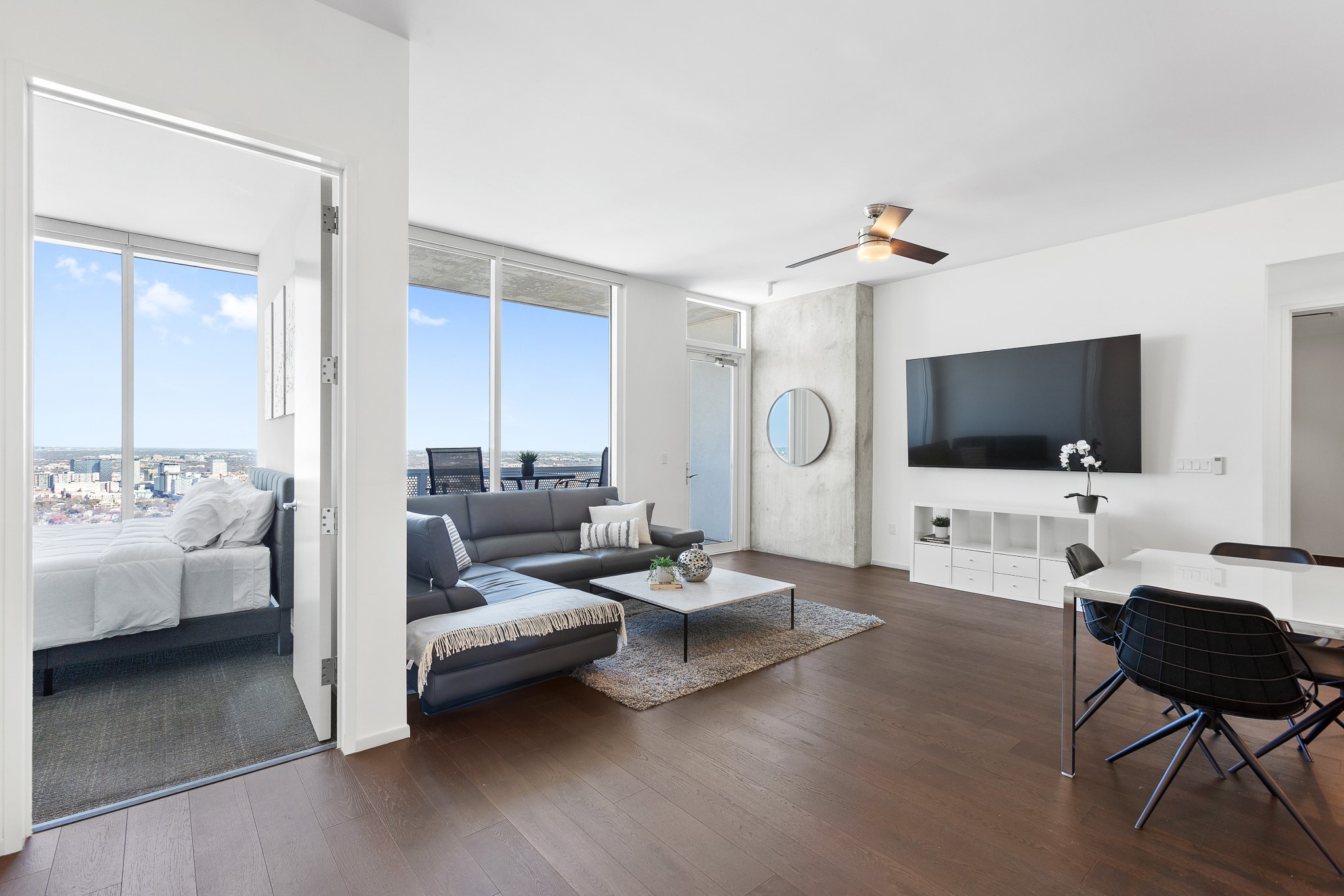 301 West Avenue, Unit 5002 Austin, TX 78701 - Photo 8 of 39 a living room with furniture and a flat screen tv