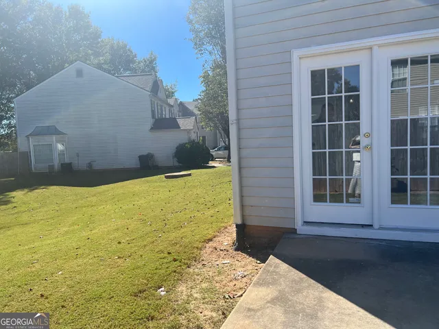 a view of a backyard of a house