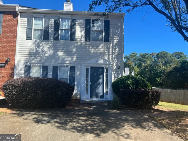 a view of a house with a garden