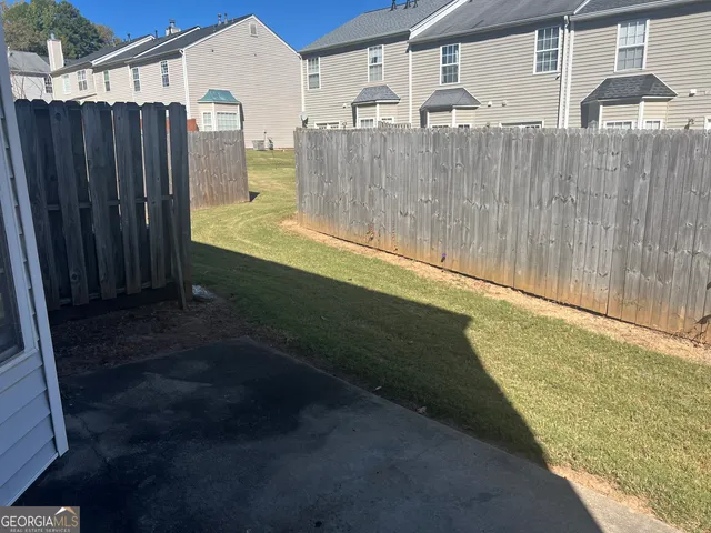 a view of a back yard of the house