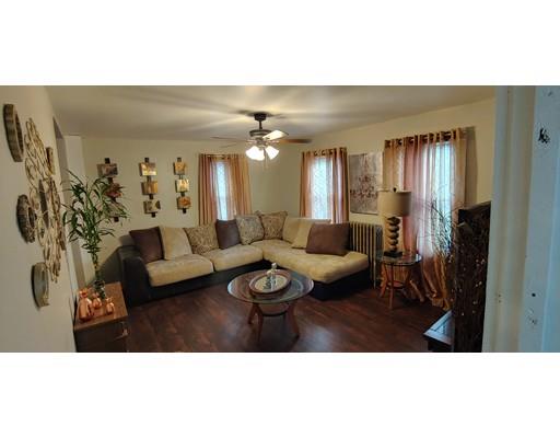 115 Allen Street Springfield, MA 01108 - Photo 4 of 21 a living room with furniture and a chandelier