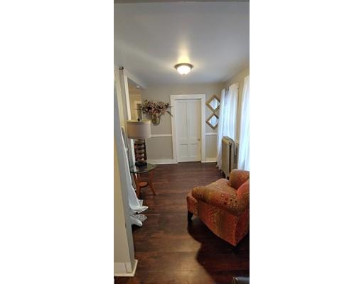 115 Allen Street Springfield, MA 01108 - Photo 5 of 21 a living room with furniture and a mirror