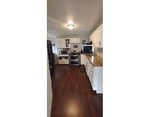 115 Allen Street Springfield, MA 01108 - Photo 10 of 21 a view of a kitchen from the hallway