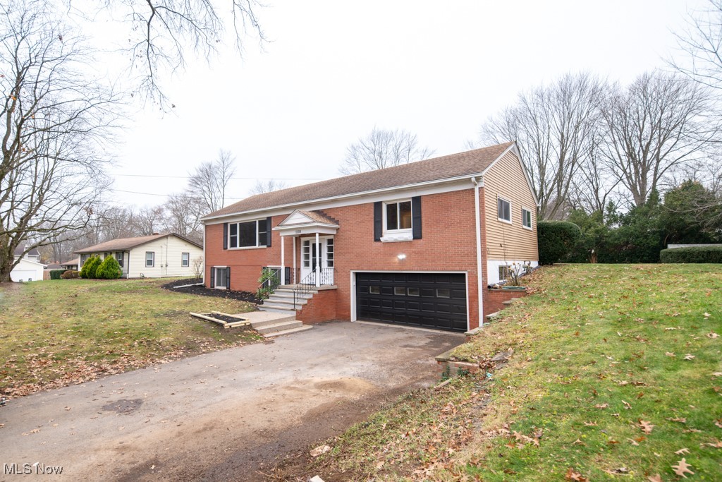 1110 Oak Tree Road Akron, OH 44320 - Photo 21 of 22 Raised ranch with
a front lawn, and a garage