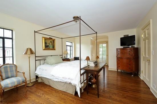 1119 Locust Road Wilmette, IL 60091 - Photo 16 of 25 a bedroom with a bed and wooden floor