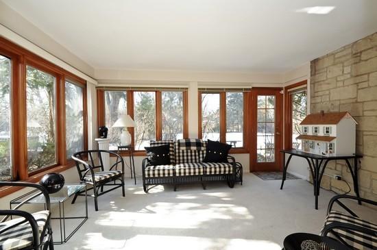1119 Locust Road Wilmette, IL 60091 - Photo 24 of 25 a living room with furniture and a floor to ceiling window