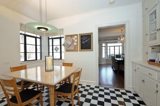 1119 Locust Road Wilmette, IL 60091 - Photo 7 of 25 a dining room with a table and chairs