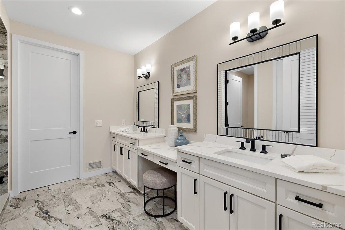 2032 Breckenridge Court, Unit 9 Rochester, MI 48309 - Photo 20 of 39 Full bathroom featuring double vanity, light marble finish floors, a stall shower, and recessed lighting