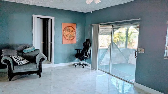 a livingroom with furniture and a window