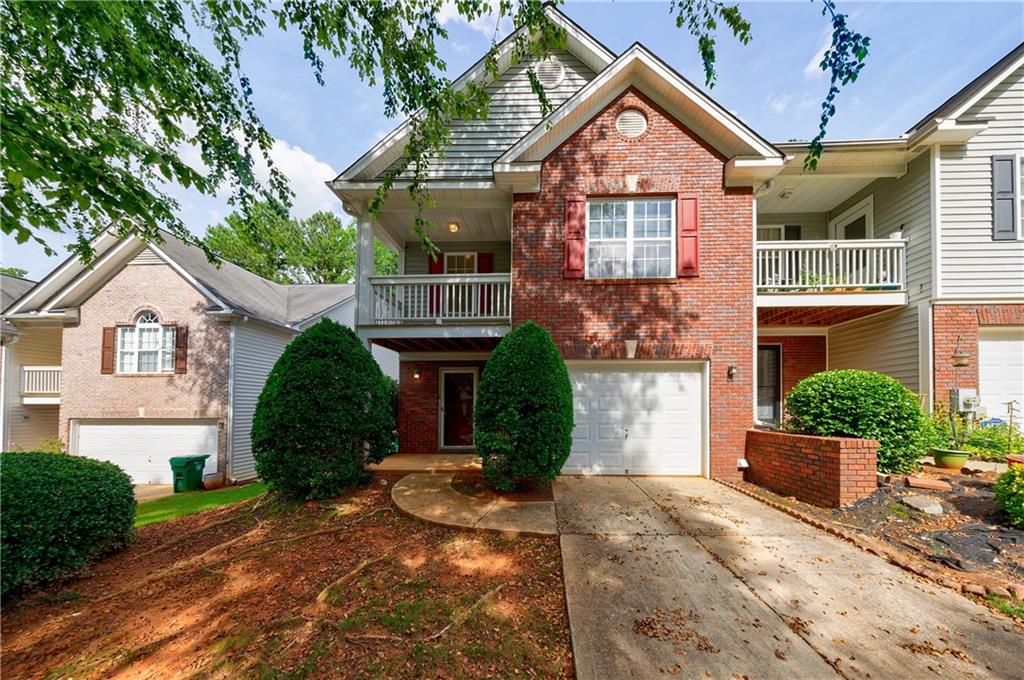 a view of a house with a yard and plants