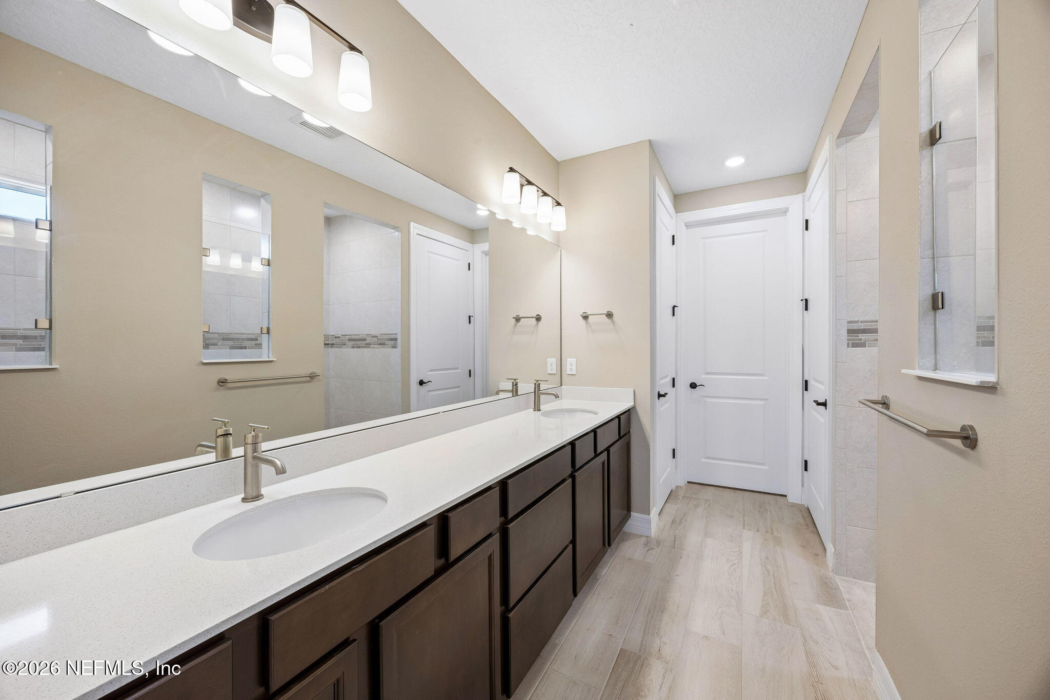 729 Continuum Loop Yulee, FL 32097 - Photo 24 of 55 Primary bathroom with double sinks and,
