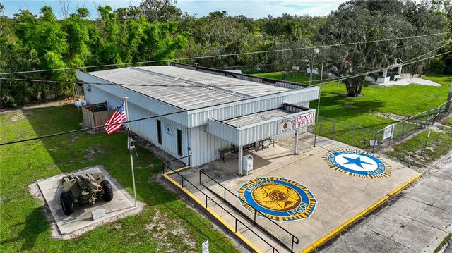 a view of a backyard with sitting area and outdoor kitchen